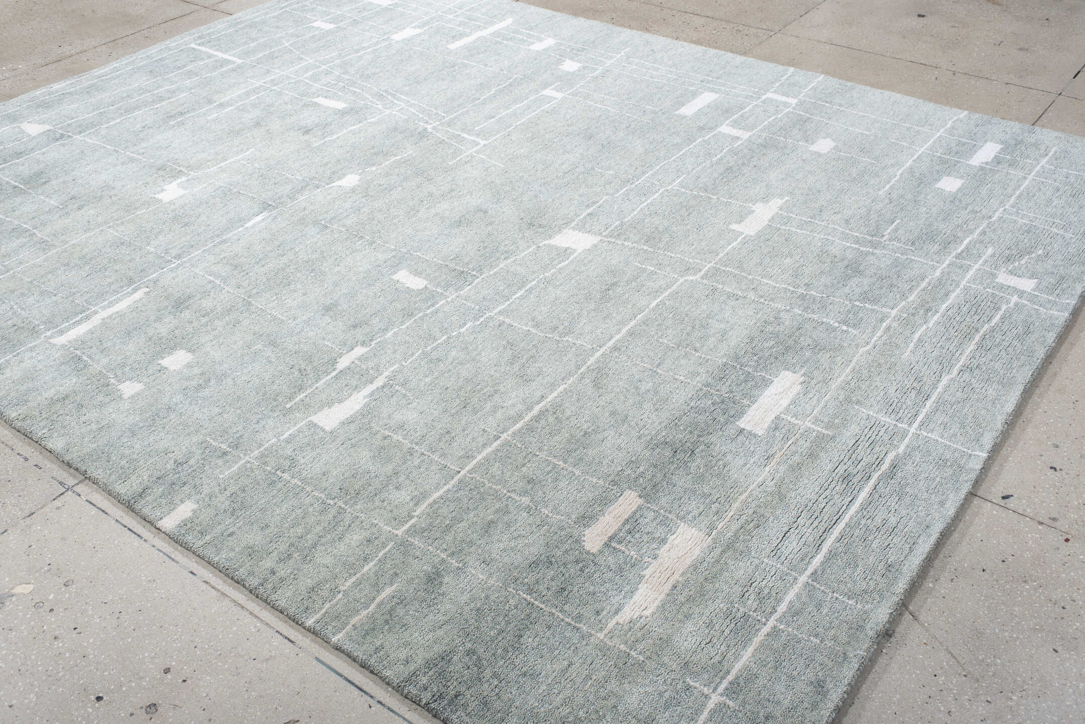 8' x 10' one-of-a-kind handmade vintage Tribeca large size rug. Color palette: pale blue, ivory, silver, mist, light blue