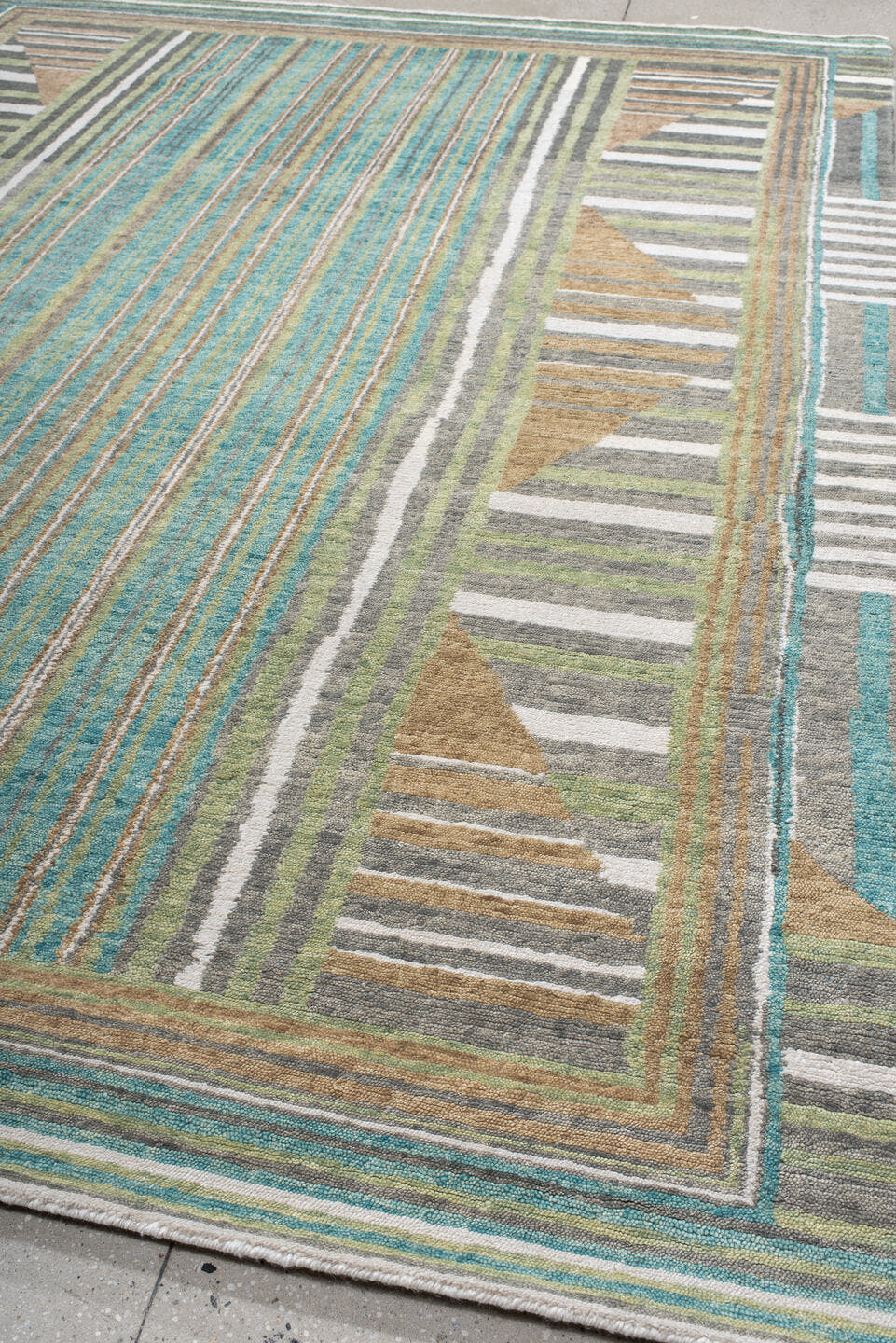 9' x 12' one-of-a-kind handmade vintage Tribeca large size rug. Color palette: teal, ivory, charcoal, taupe, olive, camel