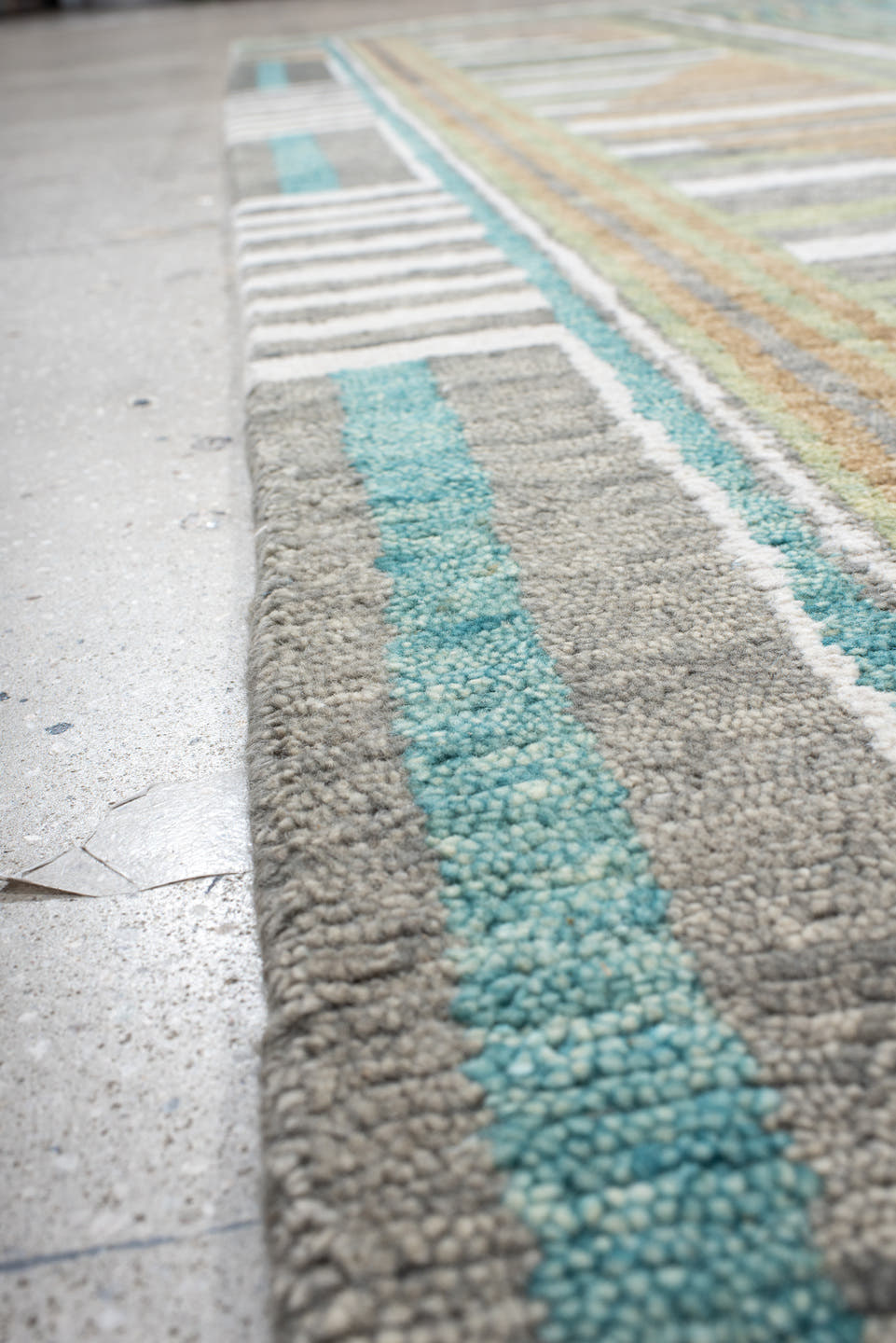 9' x 12' one-of-a-kind handmade vintage Tribeca large size rug. Color palette: teal, ivory, charcoal, taupe, olive, camel