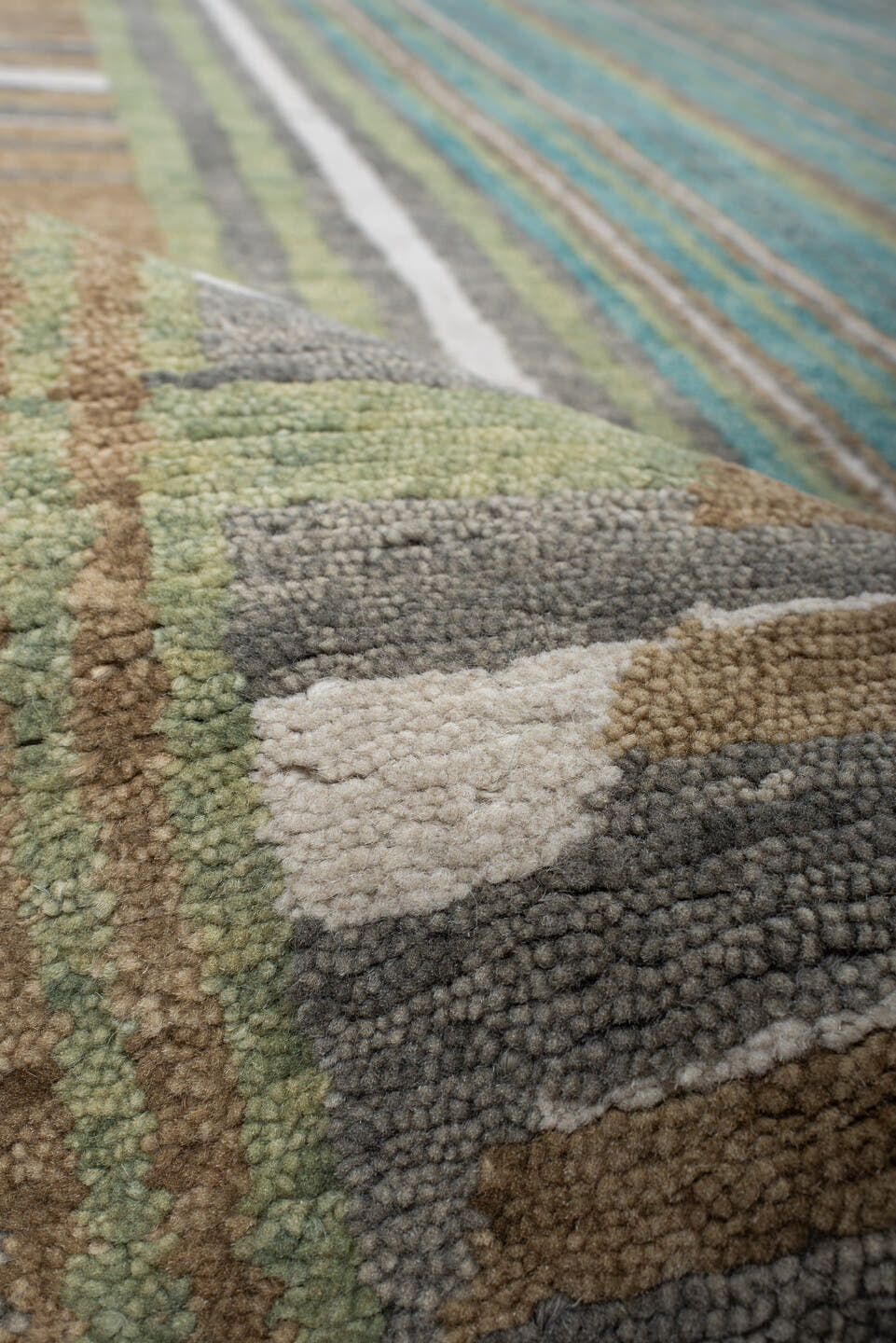 9' x 12' one-of-a-kind handmade vintage Tribeca large size rug. Color palette: teal, ivory, charcoal, taupe, olive, camel