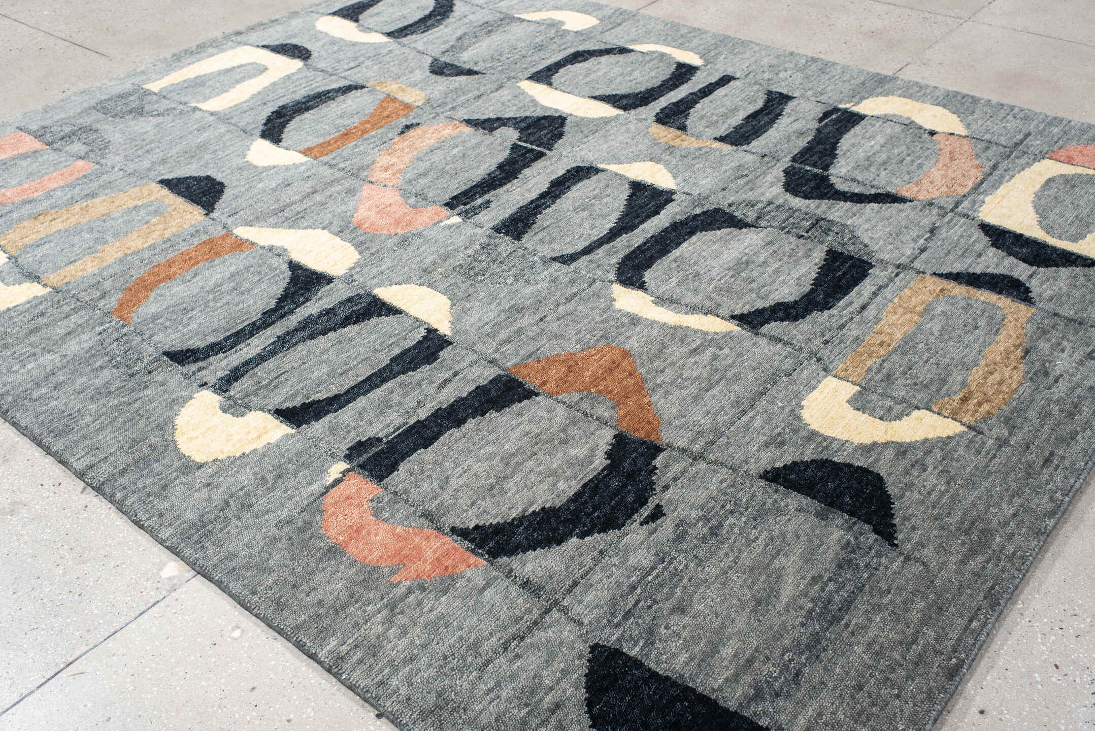 8' x 10' one-of-a-kind handmade vintage Tribeca large size rug. Color palette: charcoal, gray, black, ivory, rose, camel