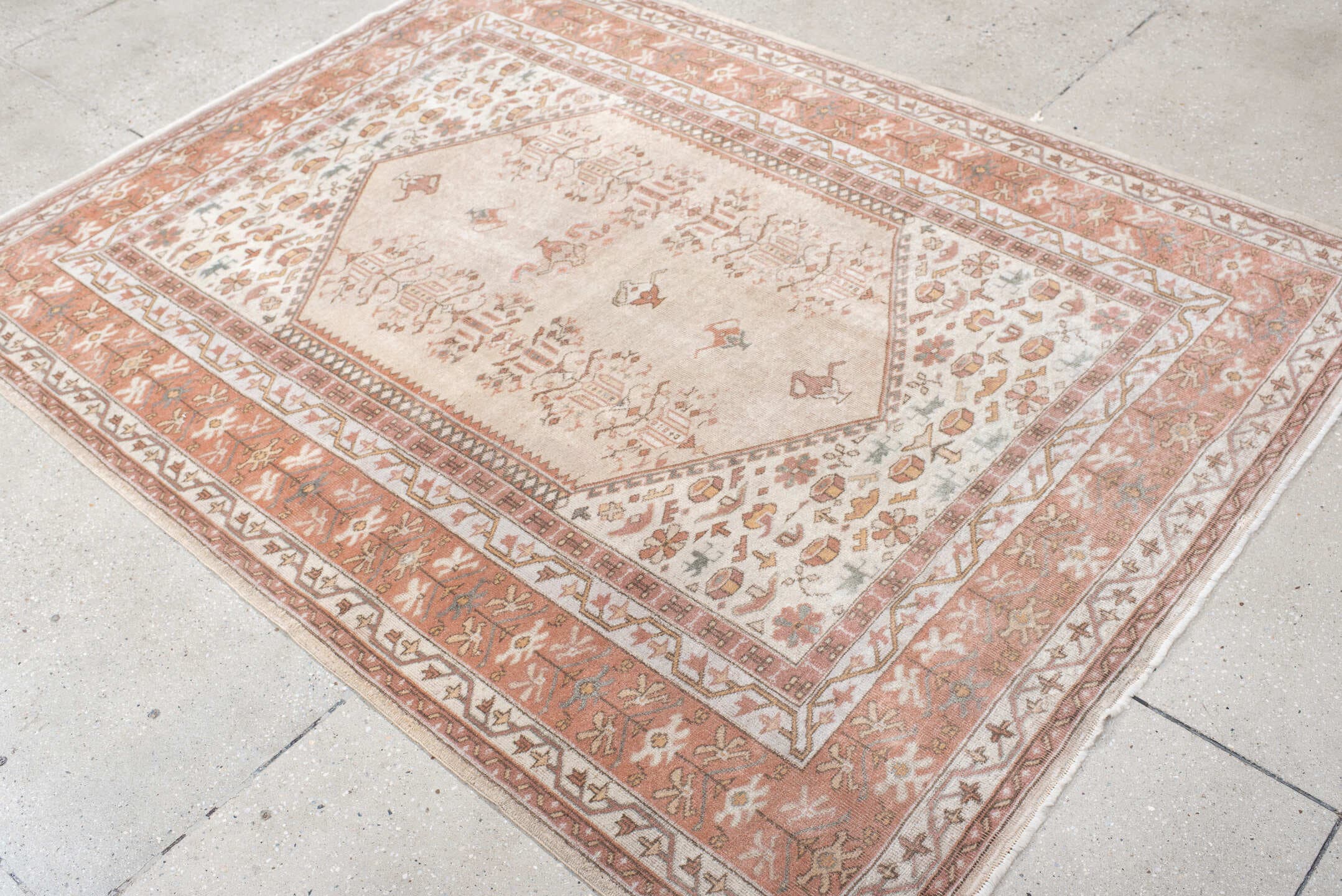 5' x 6' one-of-a-kind handmade vintage Melas rug. Color palette: ivory, blush, salmon, taupe, gray, camel, pink, beige
