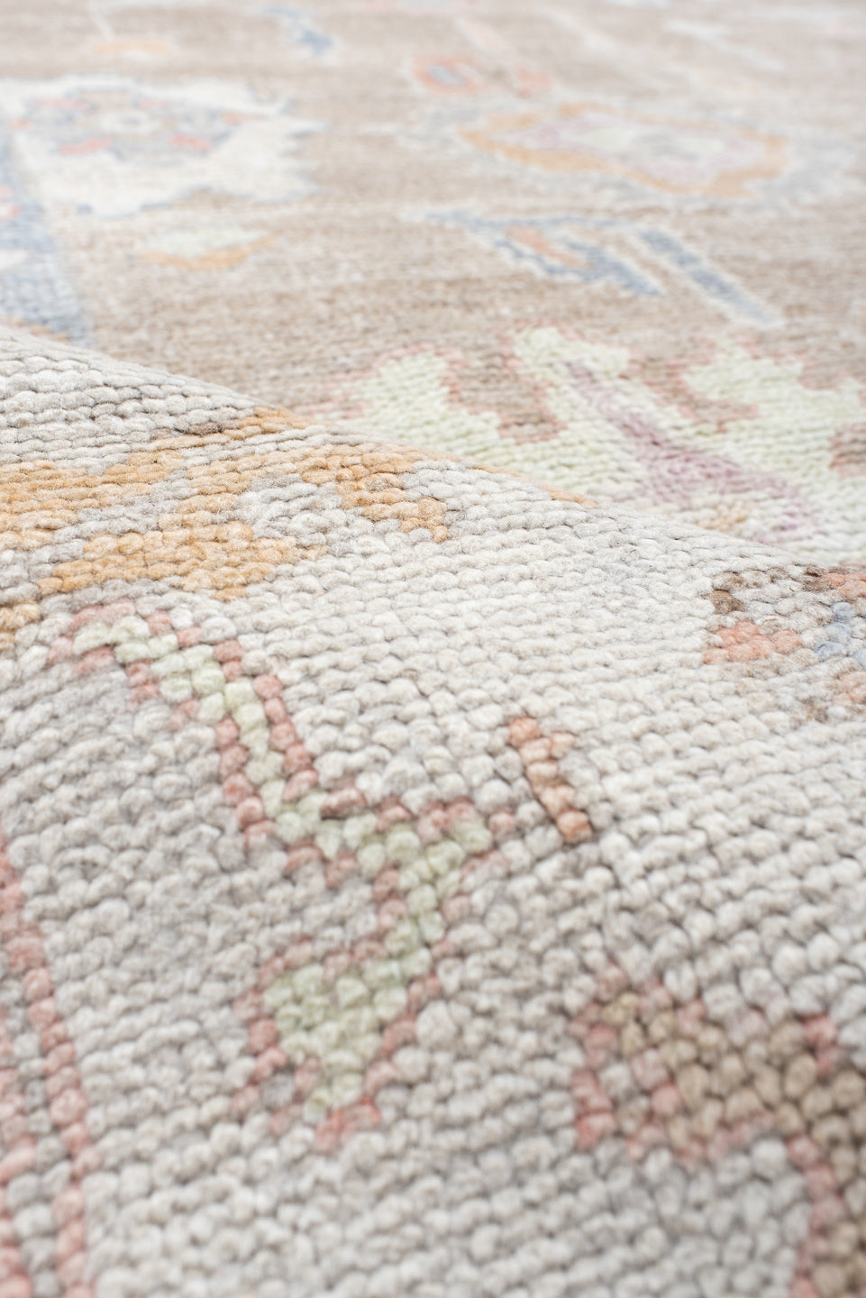 8' x 9' one-of-a-kind handmade vintage Oushak rug. Color palette: taupe, ivory, pale blue, coral, peach, beige, sage, gray