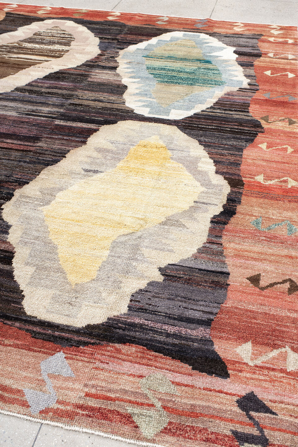 9' x 11' one-of-a-kind handmade vintage Kars large size rug. Color palette: terra cotta, charcoal, ivory, sky blue, taupe