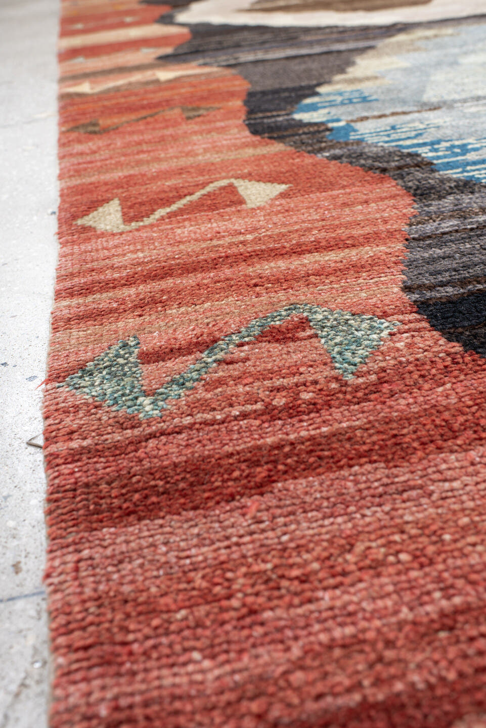 9' x 11' one-of-a-kind handmade vintage Kars large size rug. Color palette: terra cotta, charcoal, ivory, sky blue, taupe