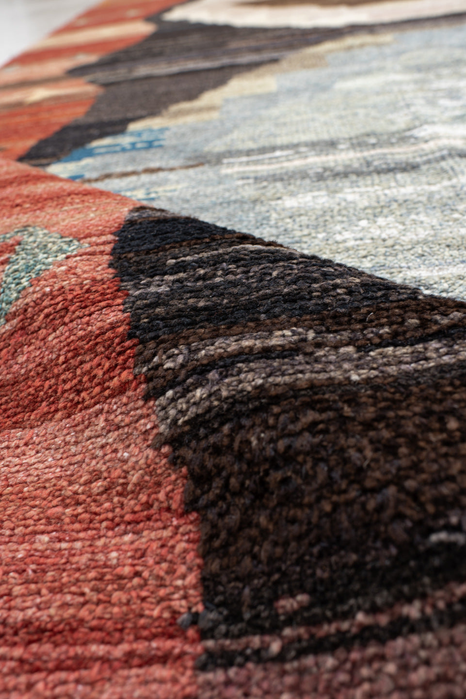 9' x 11' one-of-a-kind handmade vintage Kars large size rug. Color palette: terra cotta, charcoal, ivory, sky blue, taupe