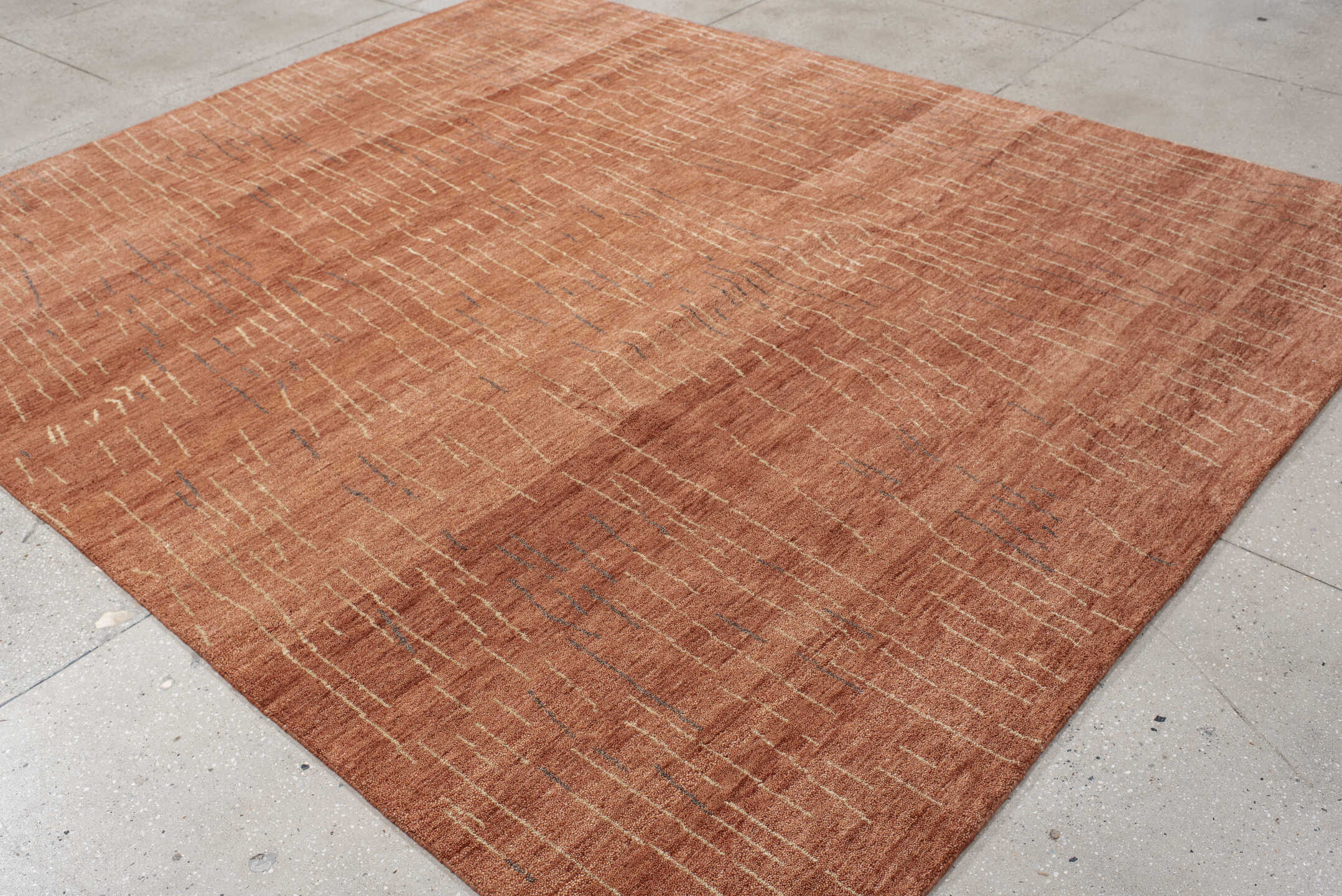 8' x 9' one-of-a-kind handmade vintage Tribeca rug. Color palette: terra cotta, rose, ivory, charcoal, terracotta, brown