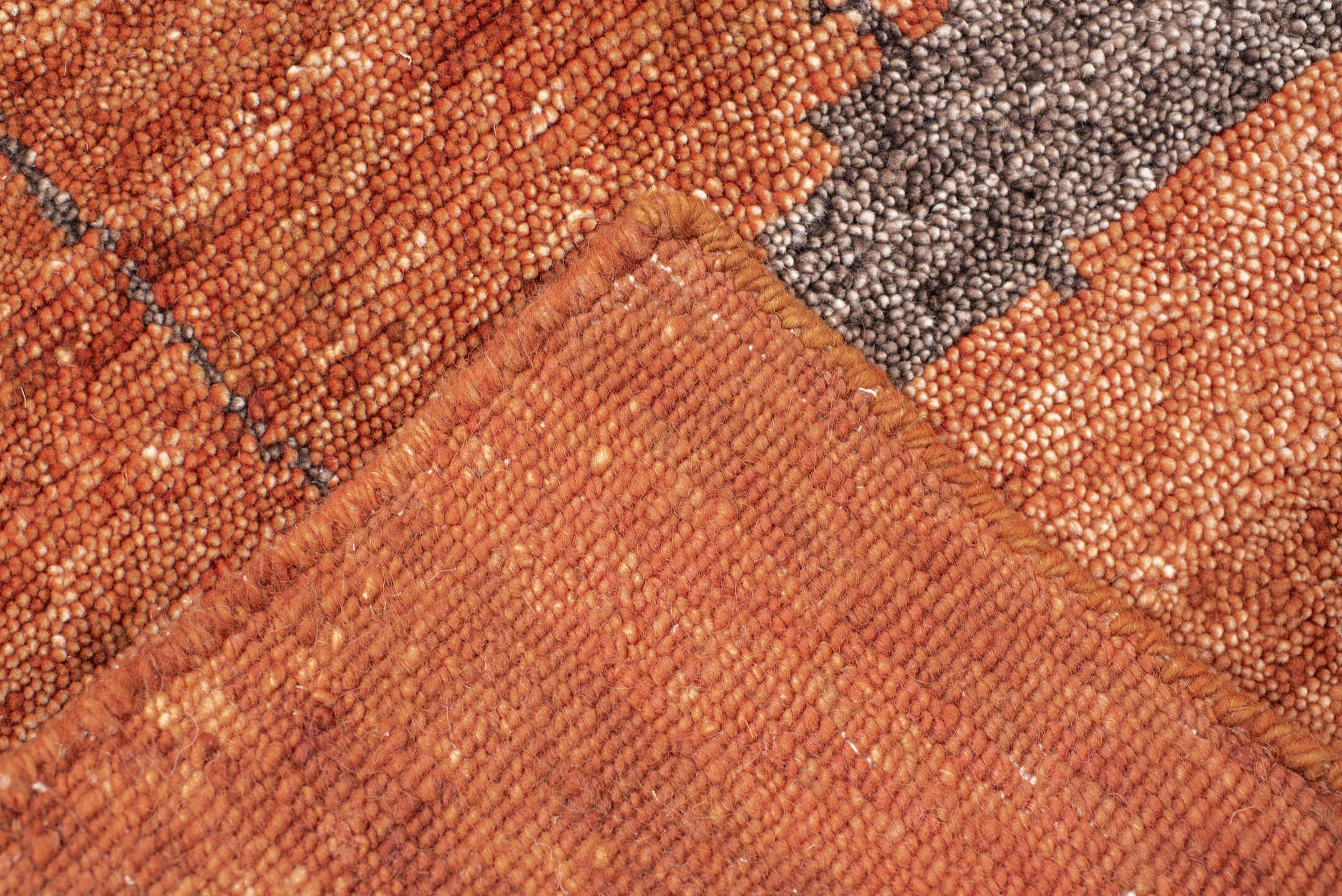 9' x 12' one-of-a-kind handmade vintage Tribeca large size rug. Color palette: terra cotta, rust, charcoal, copper