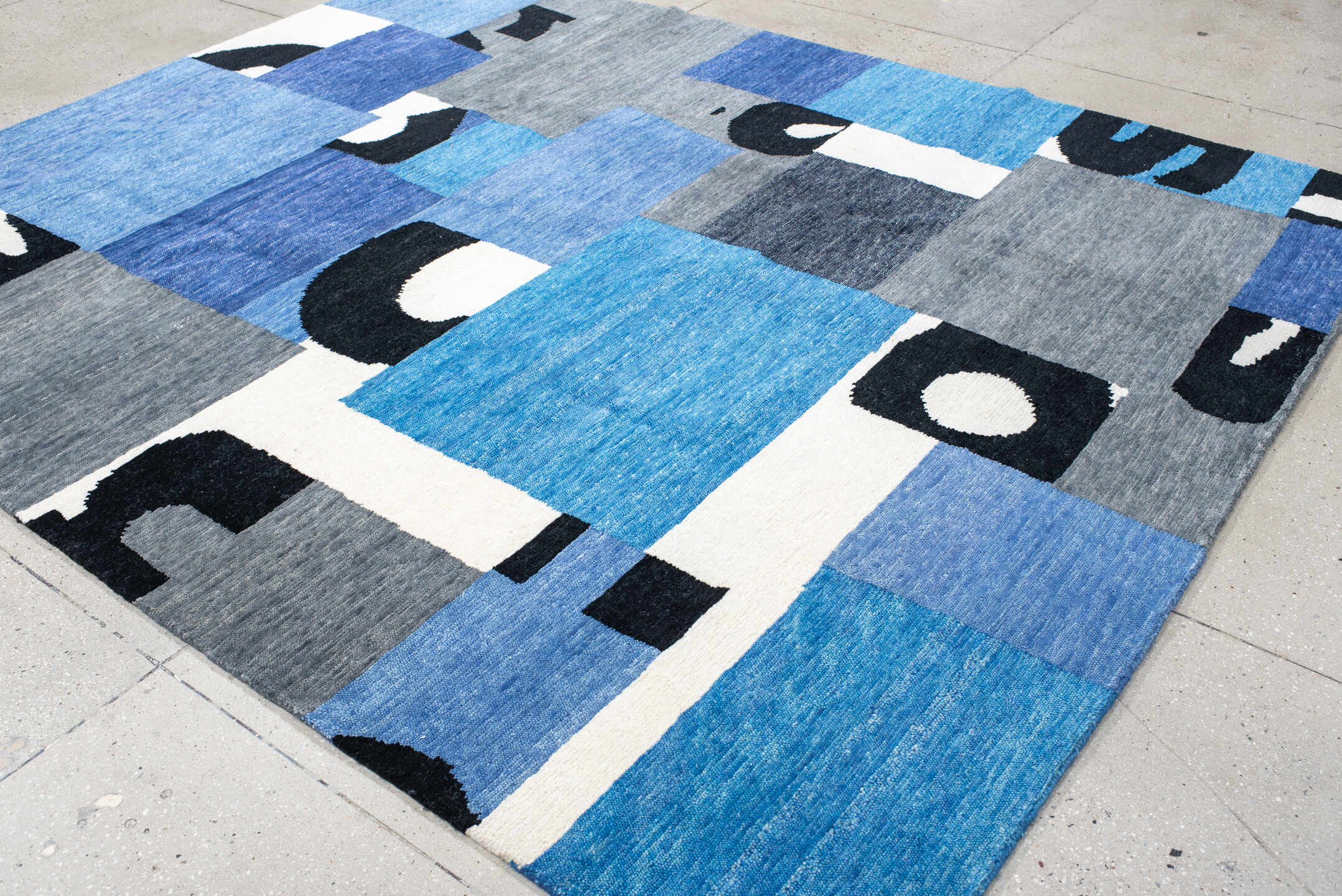 8' x 10' one-of-a-kind handmade vintage Tribeca large size rug. Color palette: blue, gray, ivory, navy, black, sky_blue