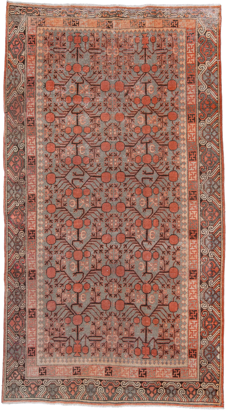 5' x 9' one-of-a-kind handmade antique Khotan medium size rug. Color palette: terra cotta, taupe, charcoal, ivory, rust