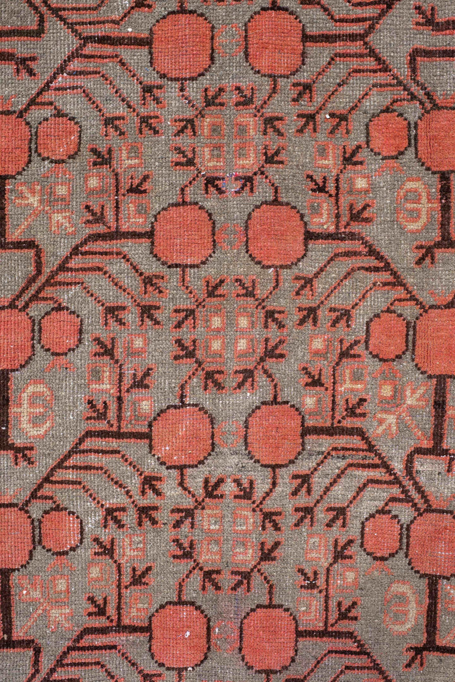 5' x 9' one-of-a-kind handmade antique Khotan medium size rug. Color palette: terra cotta, taupe, charcoal, ivory, rust