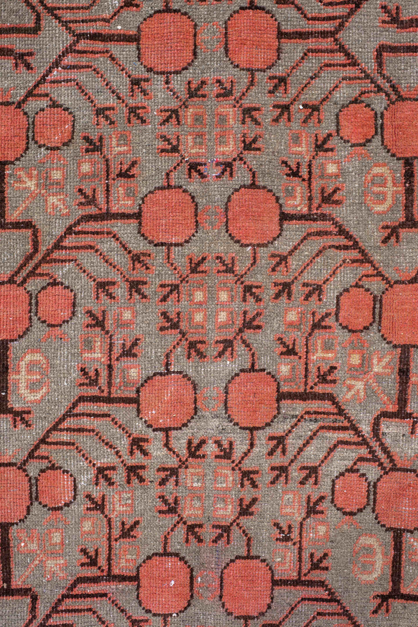 5' x 9' one-of-a-kind handmade antique Khotan medium size rug. Color palette: terra cotta, taupe, charcoal, ivory, rust