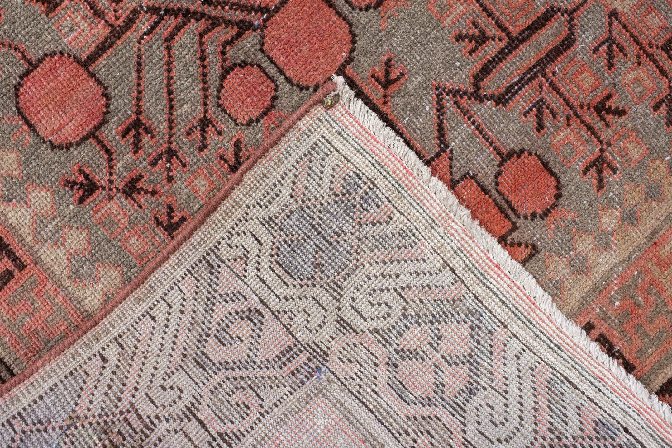 5' x 9' one-of-a-kind handmade antique Khotan medium size rug. Color palette: terra cotta, taupe, charcoal, ivory, rust