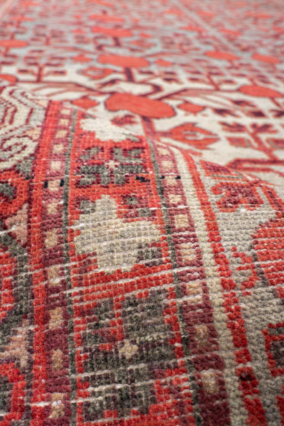 5' x 11' one-of-a-kind handmade vintage Khotan rug. Color palette: coral, ivory, slate, burgundy, rose, charcoal, terracotta