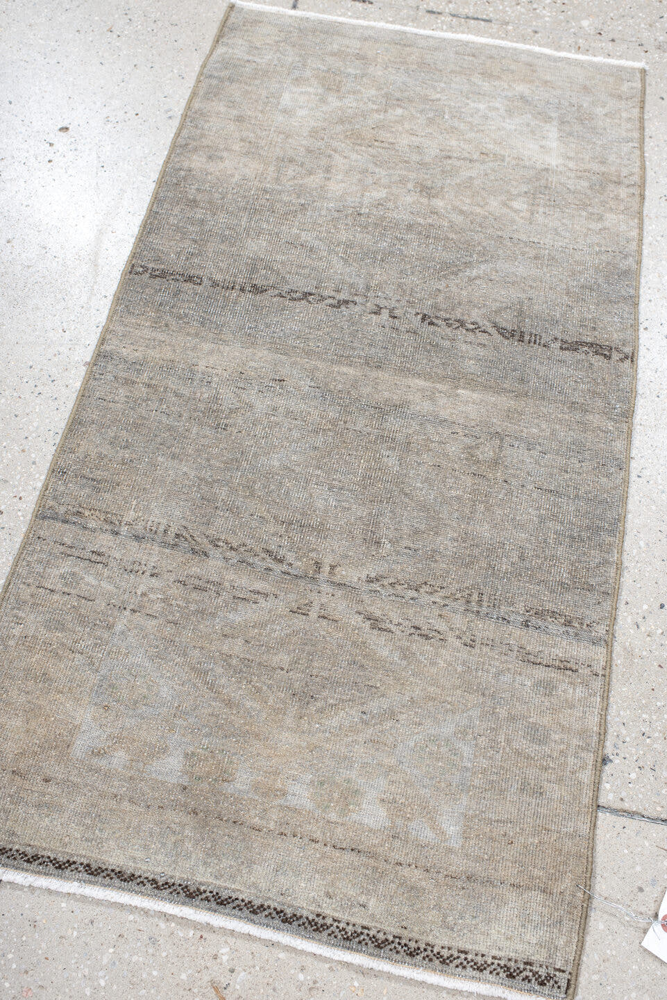 1' x 3' one-of-a-kind handmade antique Belouch small size rug. Color palette: ivory, taupe, beige, brown, gray