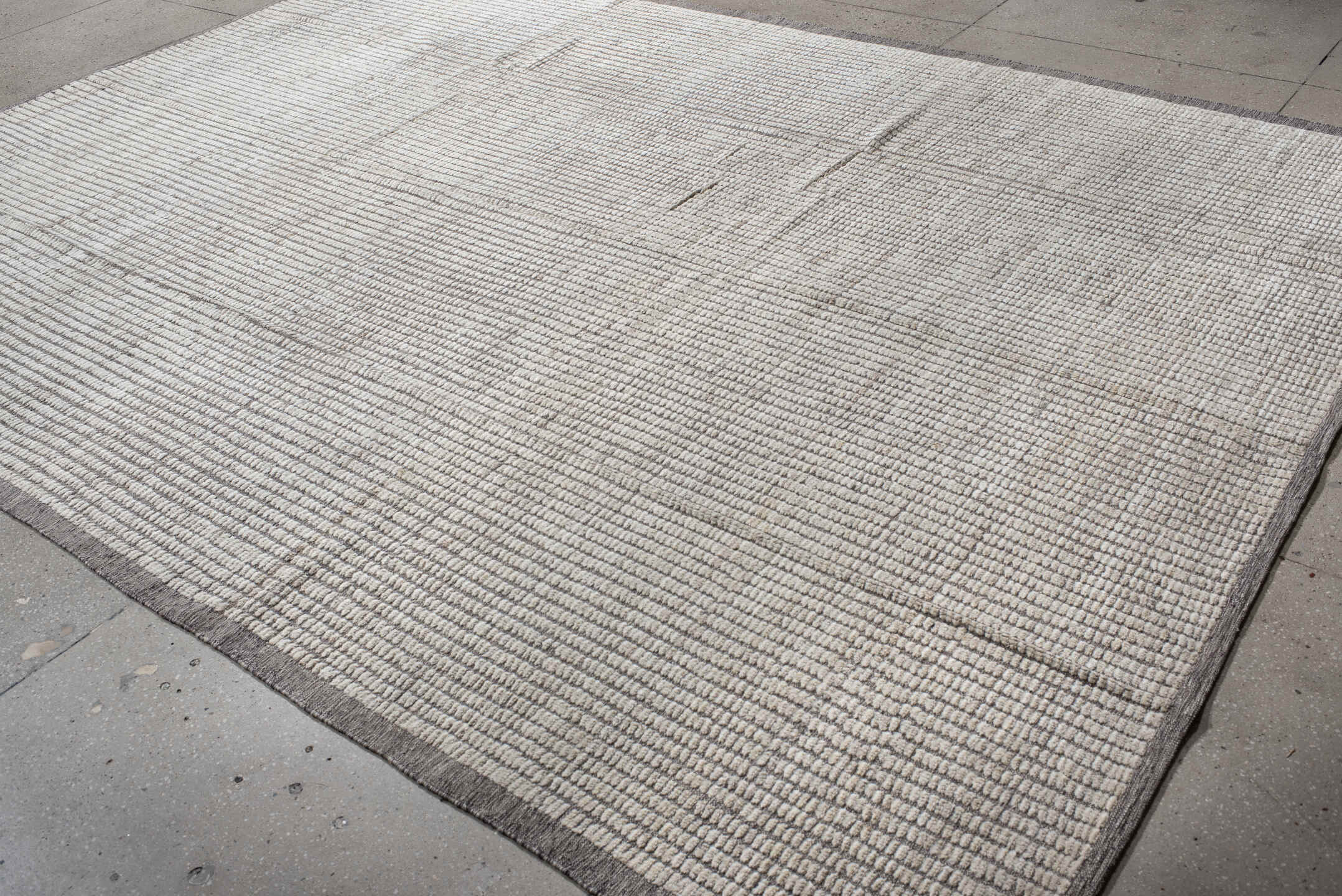 9' x 12' one-of-a-kind handmade vintage Tulu large size rug. Color palette: light gray, off-white, gray, dark gray