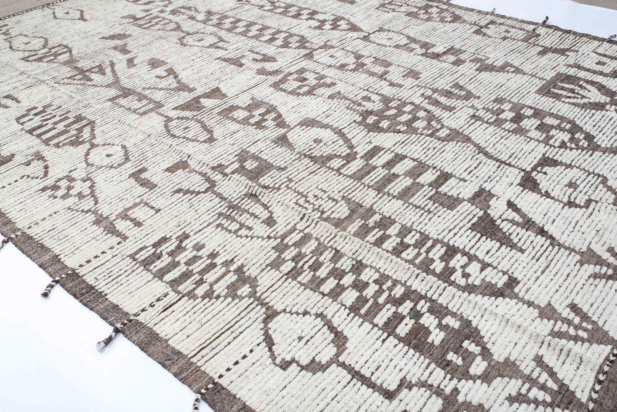 10' x 14' one-of-a-kind handmade vintage Tulu large size rug. Color palette: ivory, taupe, brown, beige, gray