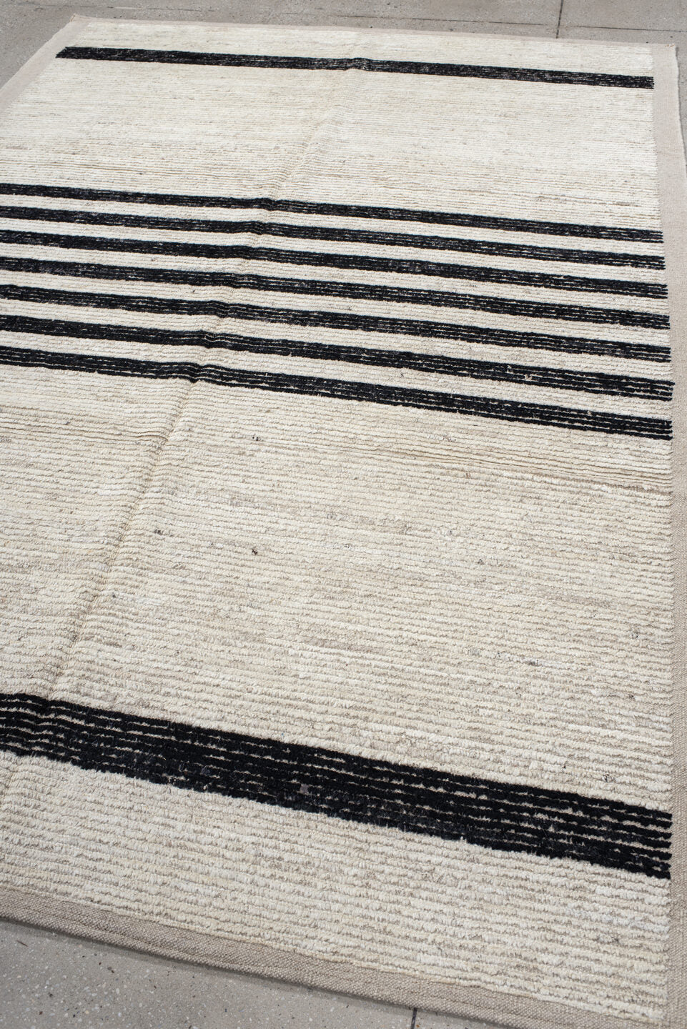 6' x 9' one-of-a-kind handmade vintage Tulu medium size rug. Color palette: ivory, charcoal, beige, gray, black