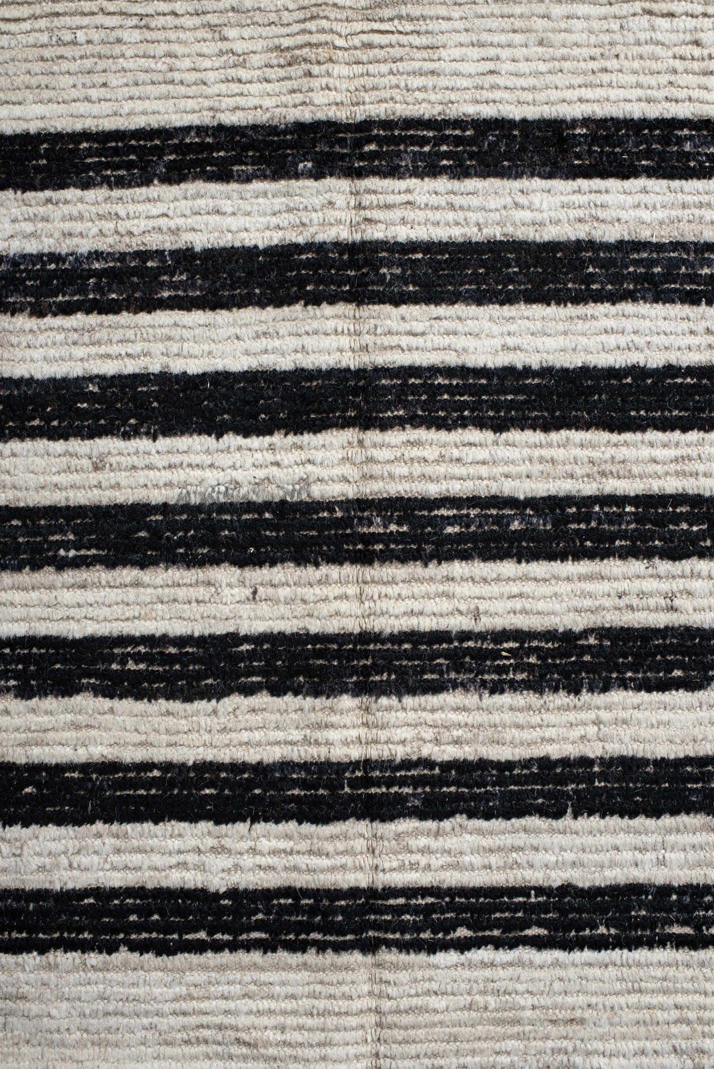 6' x 9' one-of-a-kind handmade vintage Tulu medium size rug. Color palette: ivory, charcoal, beige, gray, black