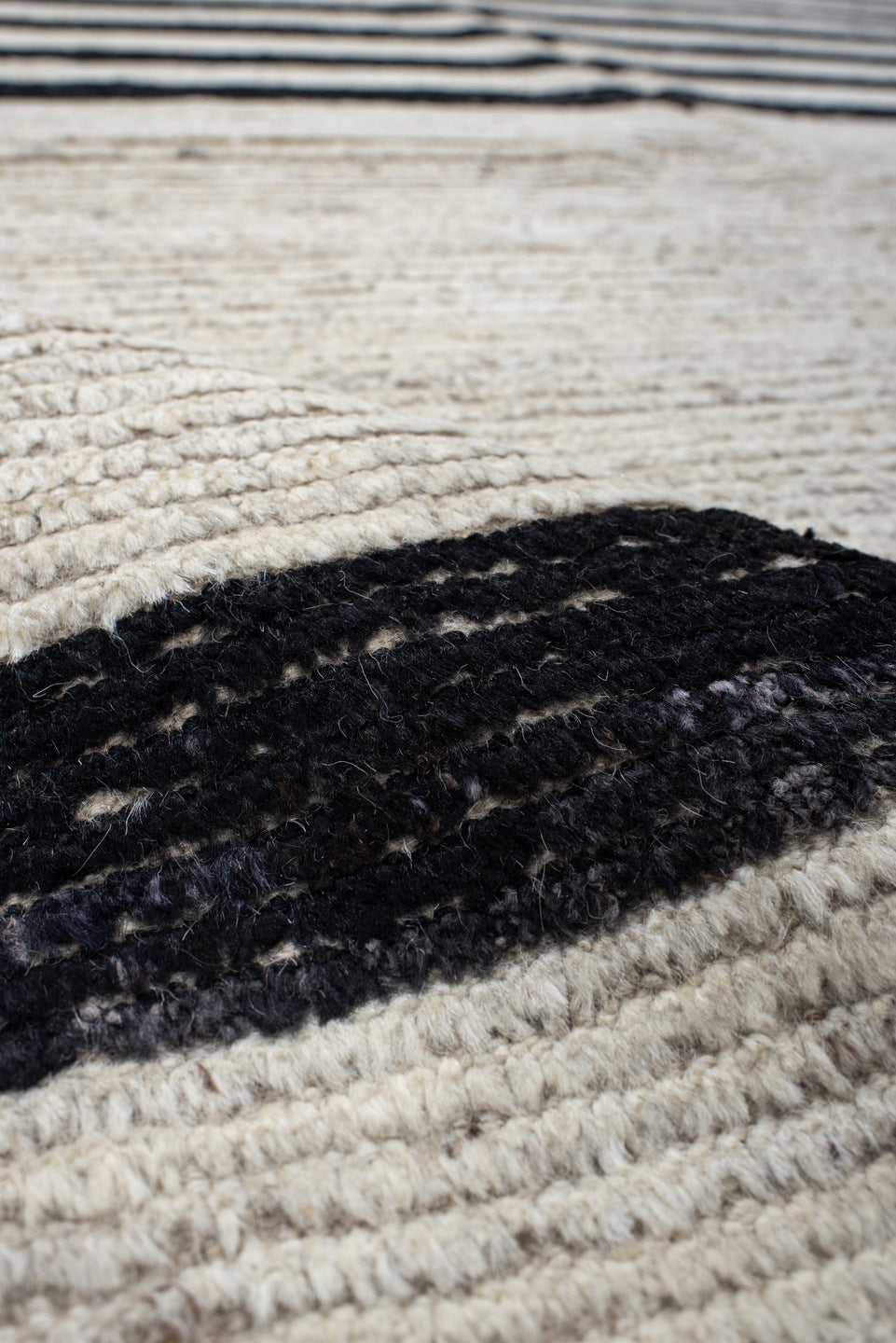 6' x 9' one-of-a-kind handmade vintage Tulu medium size rug. Color palette: ivory, charcoal, beige, gray, black