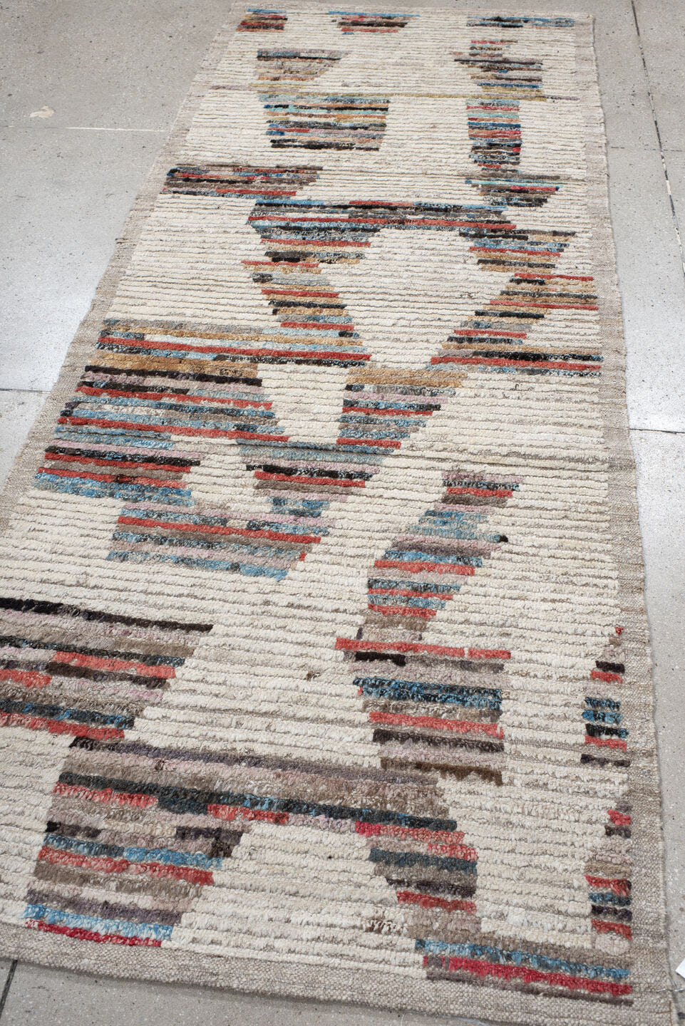 3' x 8' one-of-a-kind handmade vintage Tulu runner rug. Color palette: ivory, taupe, sky blue, rust, charcoal, camel, gray