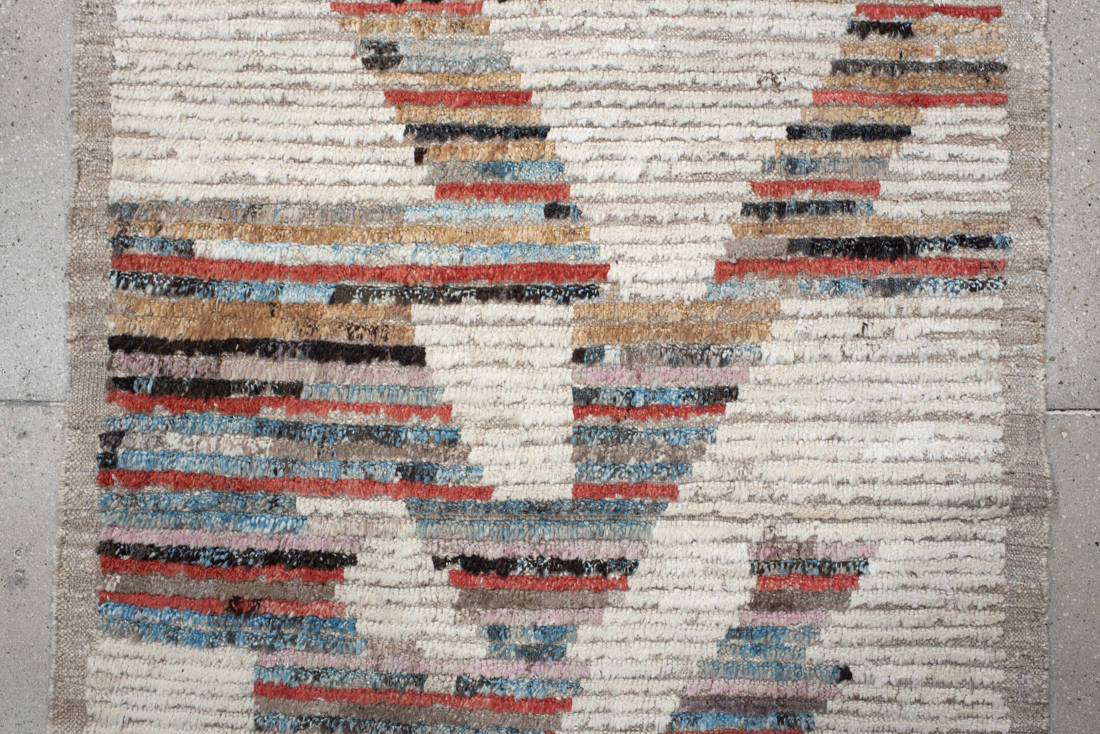 3' x 8' one-of-a-kind handmade vintage Tulu runner rug. Color palette: ivory, taupe, sky blue, rust, charcoal, camel, gray