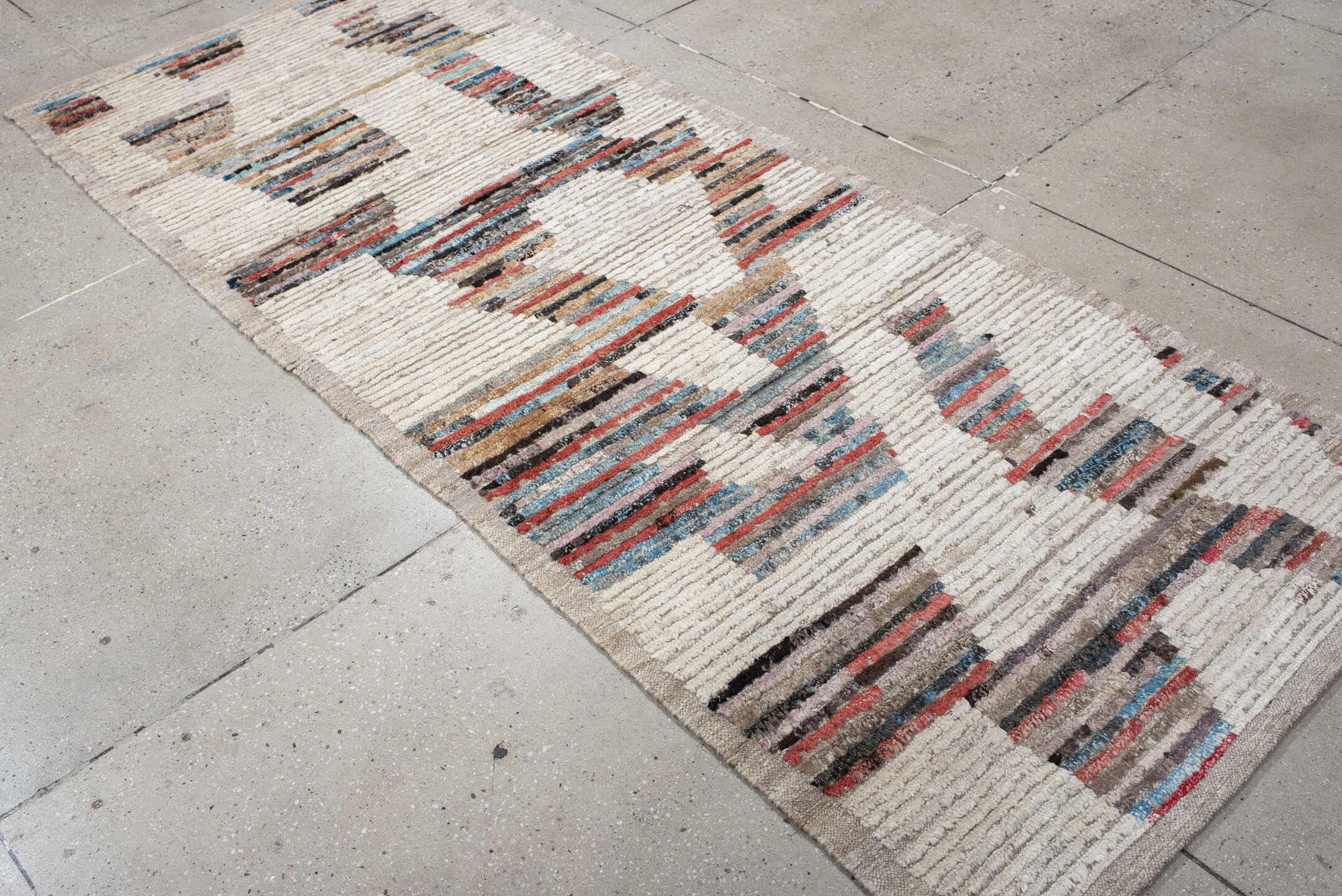3' x 8' one-of-a-kind handmade vintage Tulu runner rug. Color palette: ivory, taupe, sky blue, rust, charcoal, camel, gray