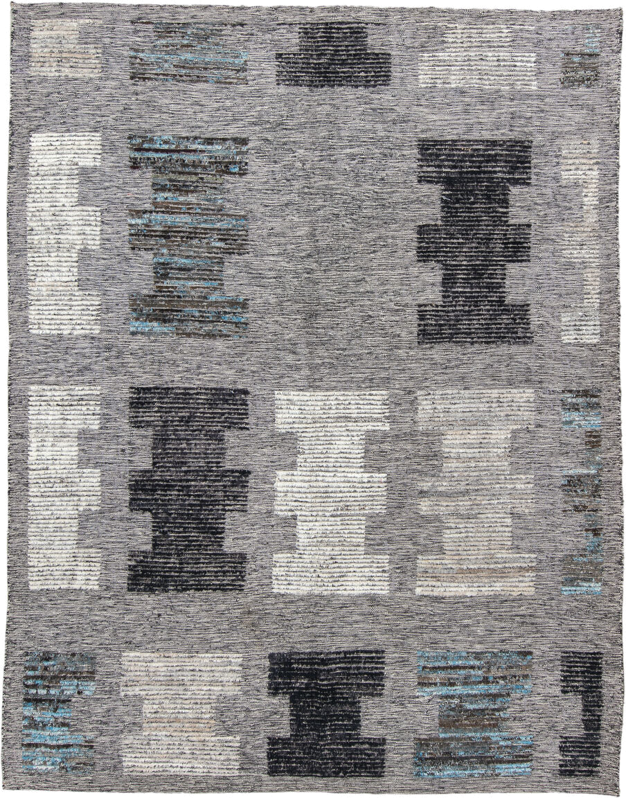 7' x 9' one-of-a-kind handmade vintage Tulu rug. Color palette: gray, charcoal, ivory, turquoise, taupe, black, teal, beige