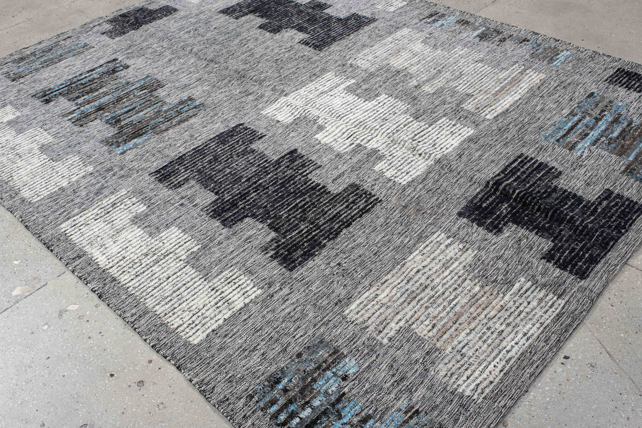 7' x 9' one-of-a-kind handmade vintage Tulu rug. Color palette: gray, charcoal, ivory, turquoise, taupe, black, teal, beige