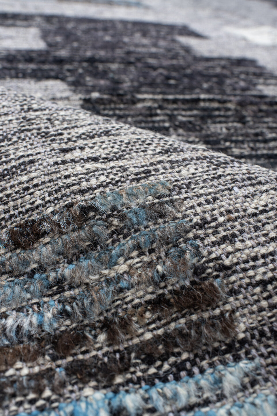 7' x 9' one-of-a-kind handmade vintage Tulu rug. Color palette: gray, charcoal, ivory, turquoise, taupe, black, teal, beige