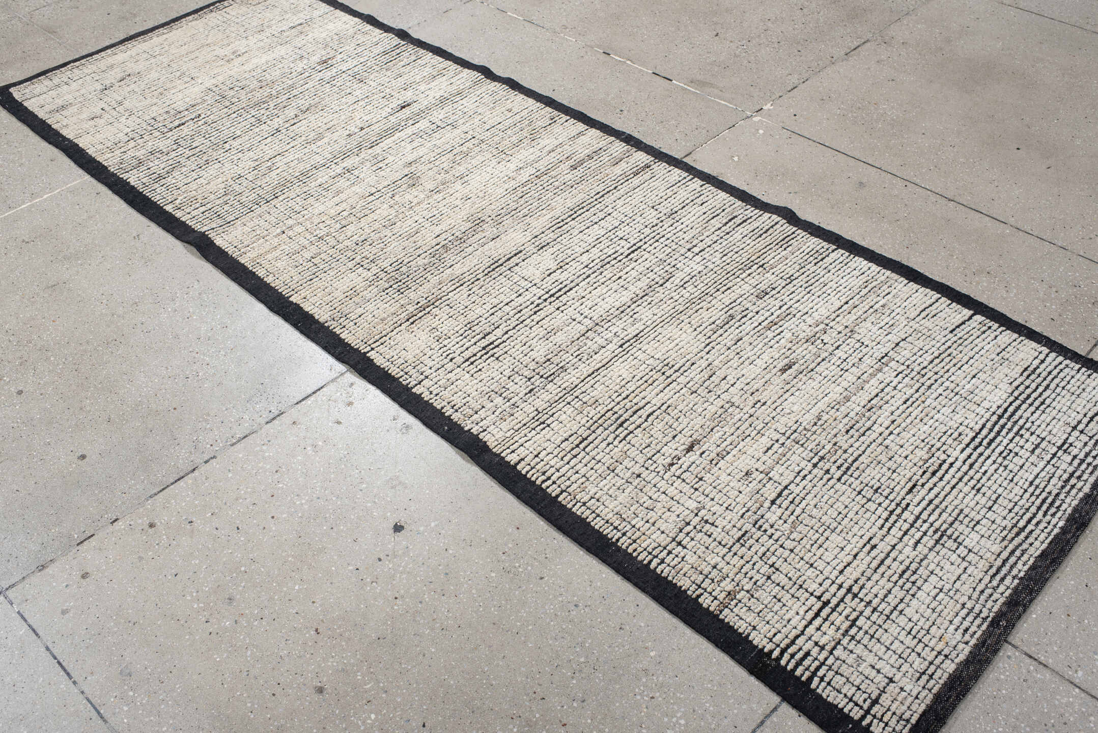 3' x 8' one-of-a-kind handmade vintage Tulu runner rug. Color palette: ivory, charcoal, black, cream, gray