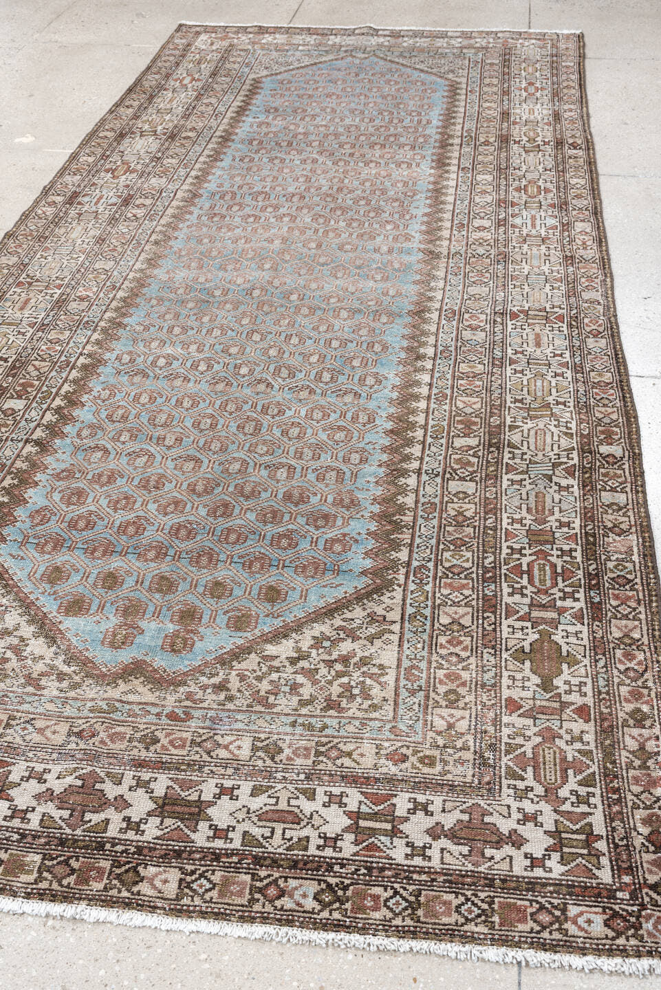 4' x 9' one-of-a-kind handmade antique Malayer runner rug. Color palette: ivory, sky blue, taupe, rust, brown, camel