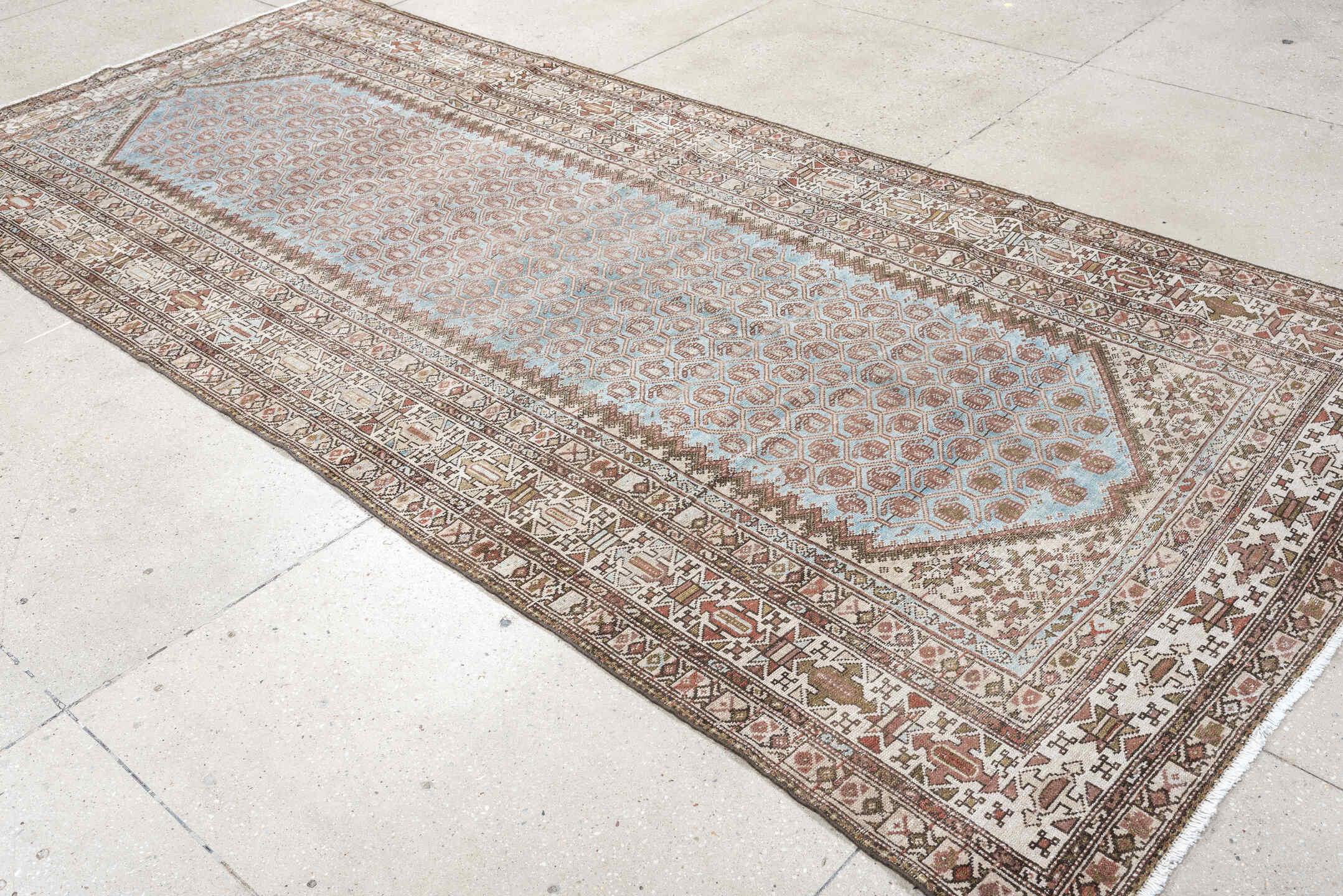 4' x 9' one-of-a-kind handmade antique Malayer runner rug. Color palette: ivory, sky blue, taupe, rust, brown, camel