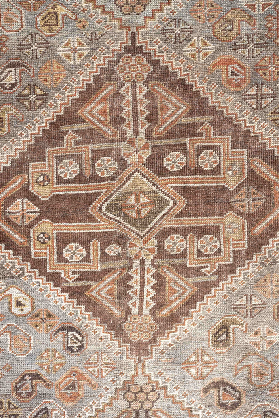 6' x 9' one-of-a-kind handmade antique Qashqai rug. Color palette: taupe, ivory, rust, slate, brown, camel, charcoal, beige