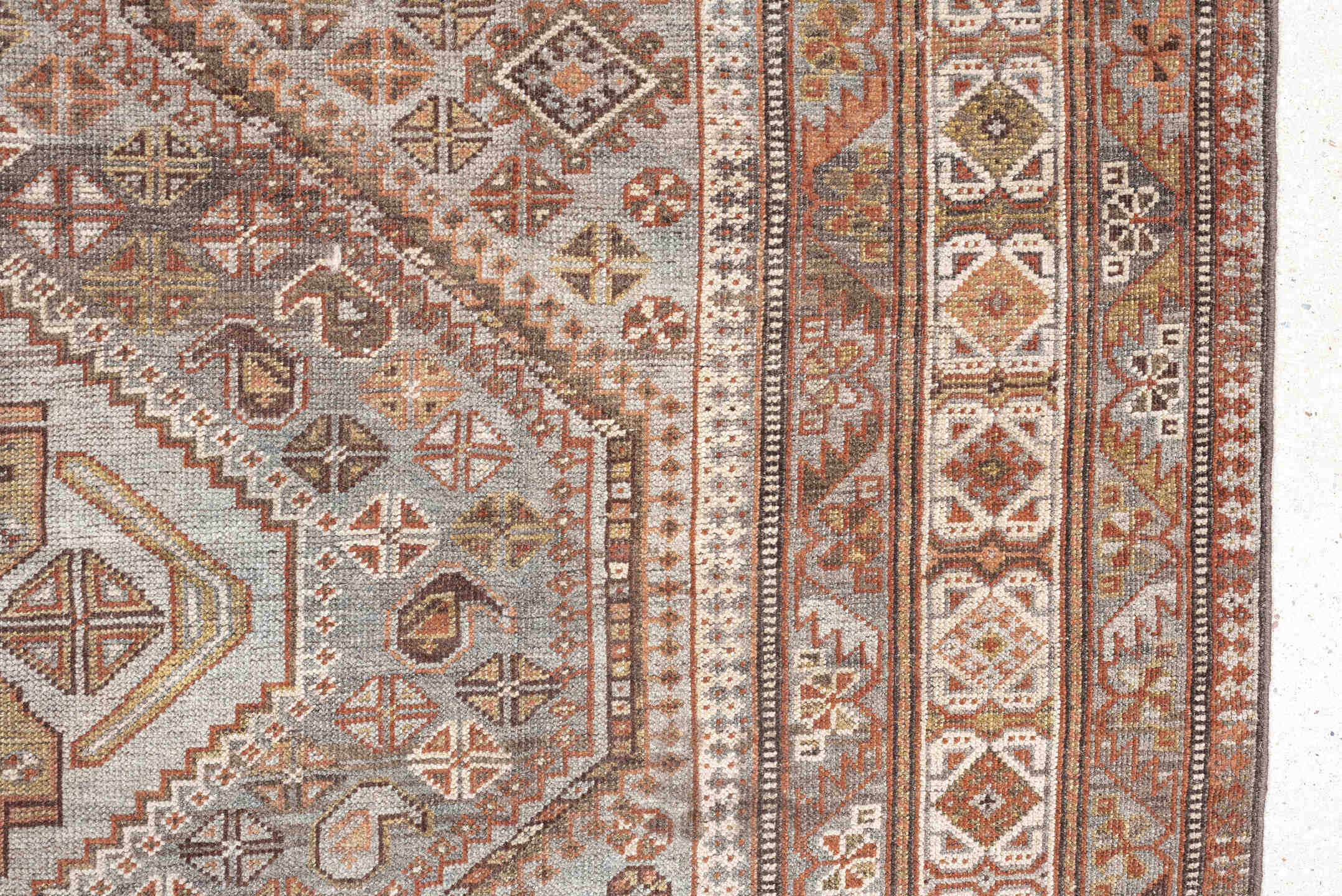 6' x 9' one-of-a-kind handmade antique Qashqai rug. Color palette: taupe, ivory, rust, slate, brown, camel, charcoal, beige