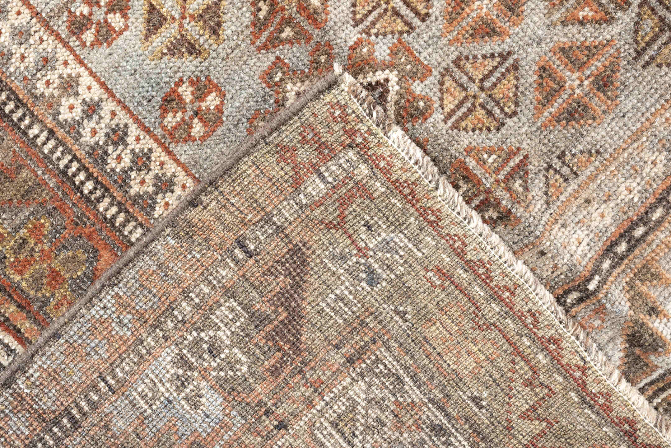 6' x 9' one-of-a-kind handmade antique Qashqai rug. Color palette: taupe, ivory, rust, slate, brown, camel, charcoal, beige