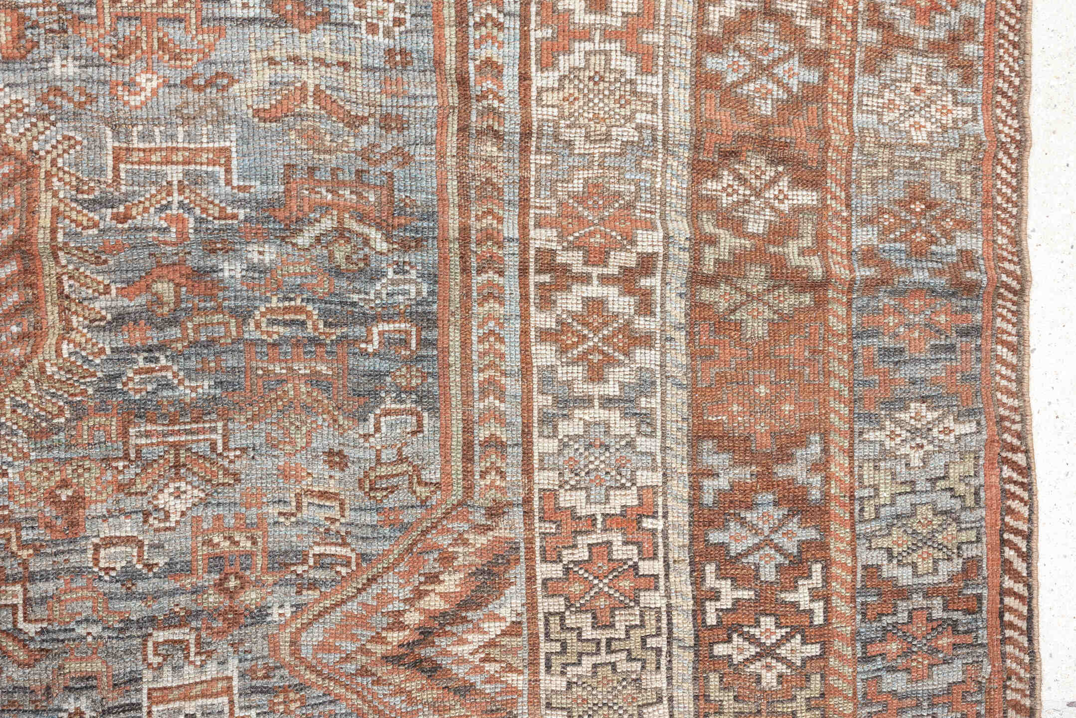 6' x 8' one-of-a-kind handmade antique Shiraz medium size rug. Color palette: blue, rust, ivory, taupe, slate, camel