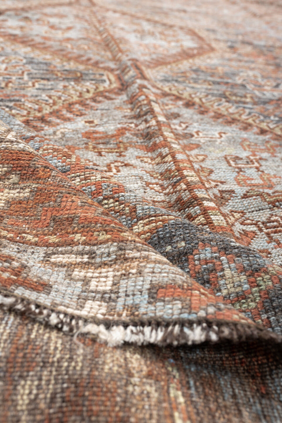6' x 8' one-of-a-kind handmade antique Shiraz medium size rug. Color palette: blue, rust, ivory, taupe, slate, camel