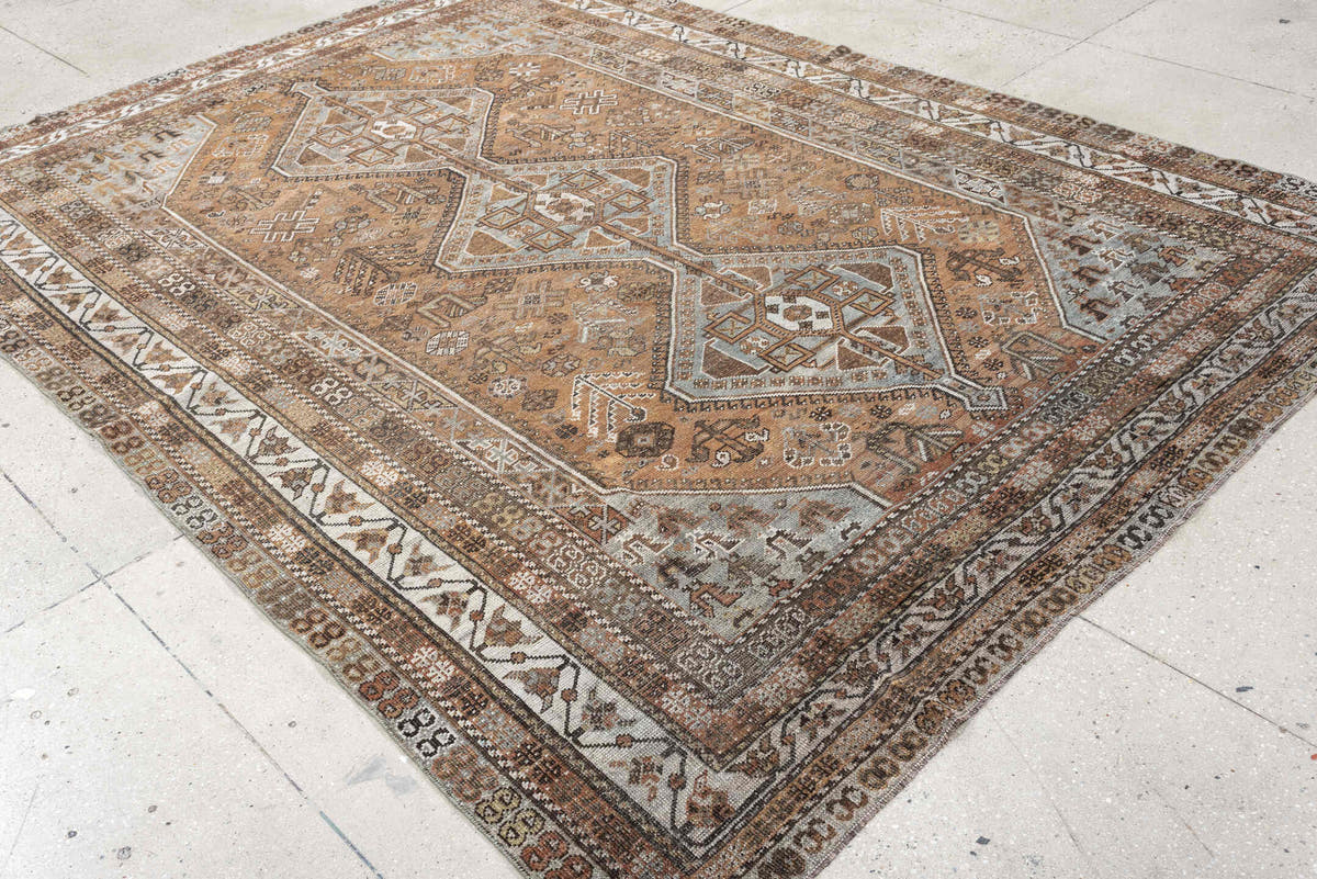 7' x 10' one-of-a-kind handmade antique Shiraz large size rug. Color palette: terra cotta, sky blue, ivory, taupe, brown