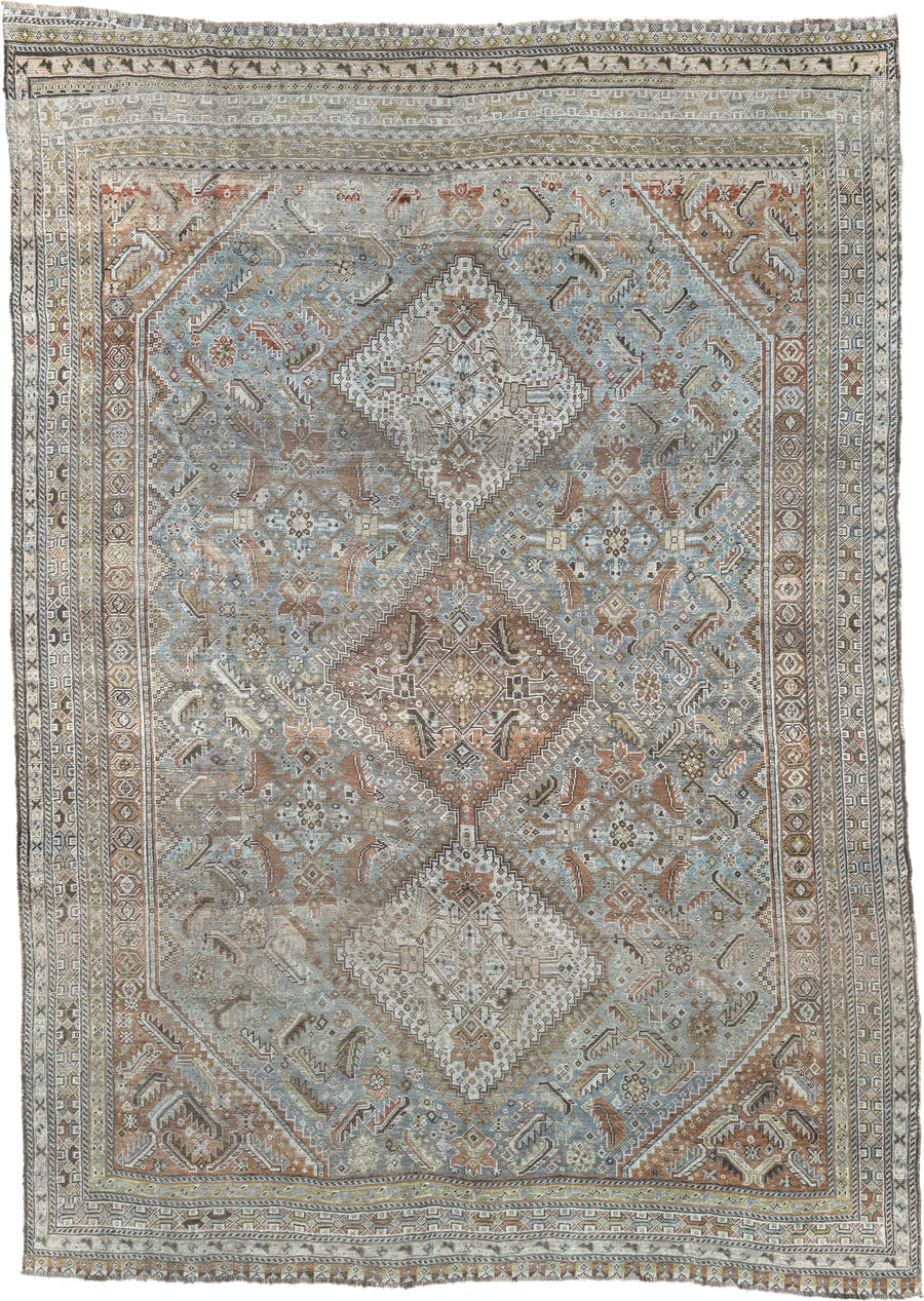 6' x 9' one-of-a-kind handmade antique Shiraz rug. Color palette: light blue, ivory, taupe, rust, brown, gold, camel