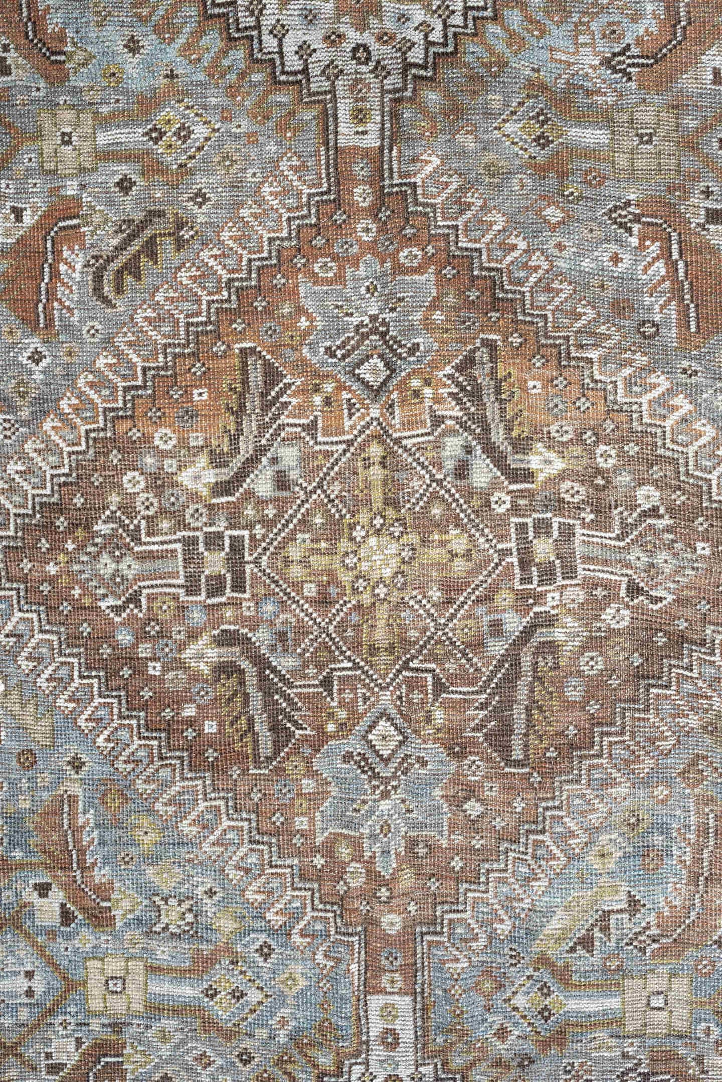 6' x 9' one-of-a-kind handmade antique Shiraz rug. Color palette: light blue, ivory, taupe, rust, brown, gold, camel