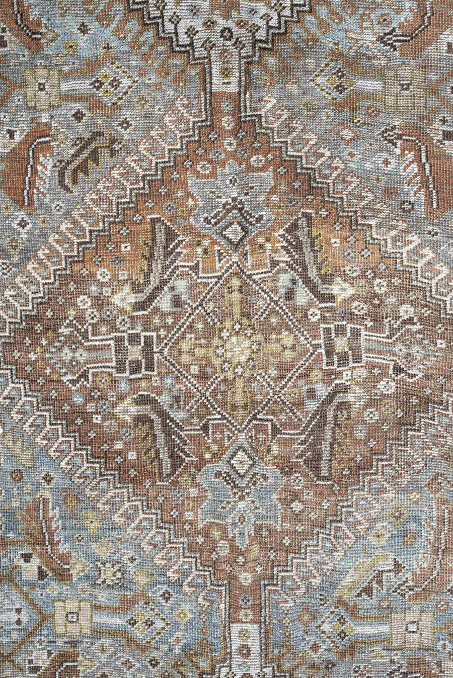 6' x 9' one-of-a-kind handmade antique Shiraz rug. Color palette: light blue, ivory, taupe, rust, brown, gold, camel
