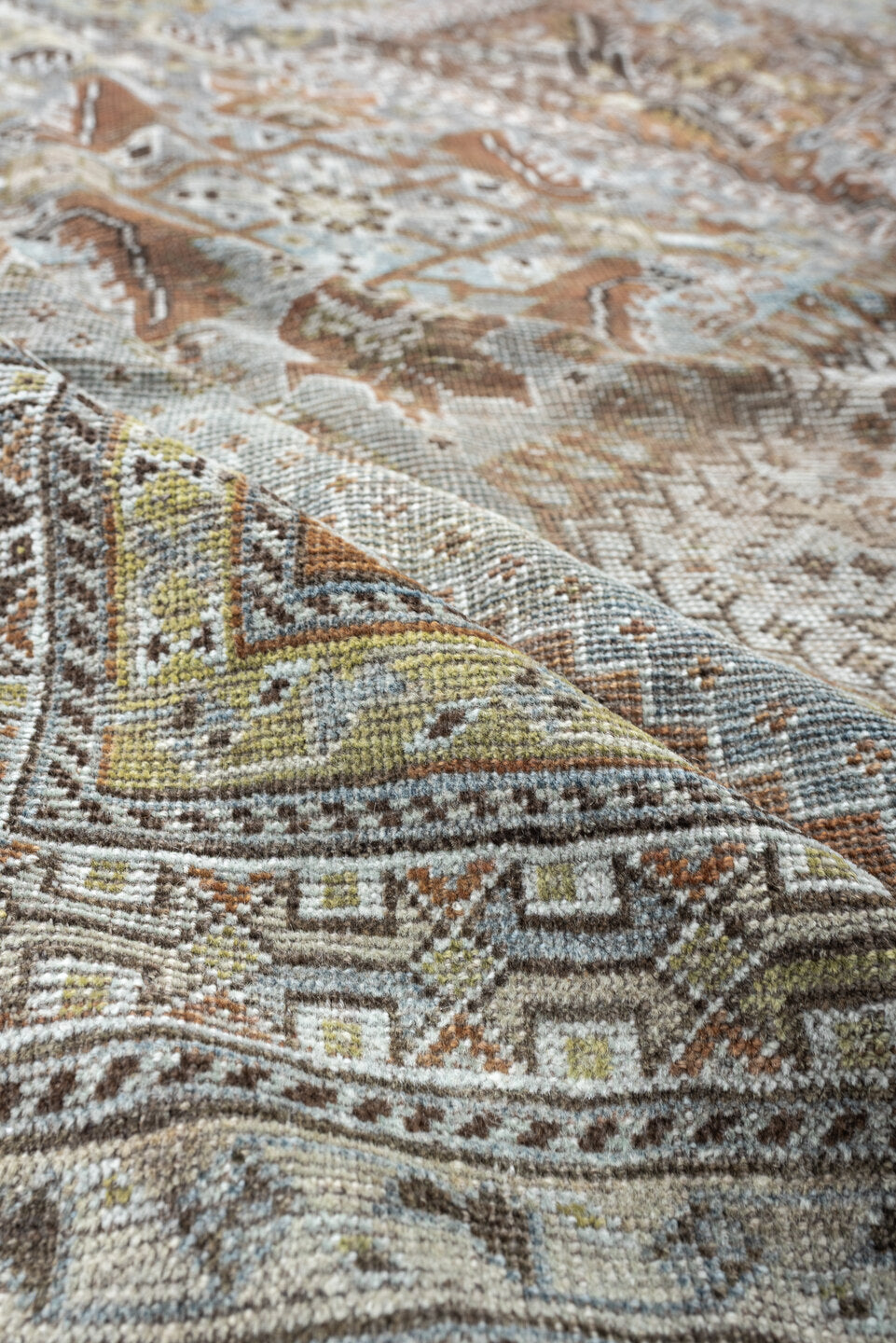 6' x 9' one-of-a-kind handmade antique Shiraz rug. Color palette: light blue, ivory, taupe, rust, brown, gold, camel