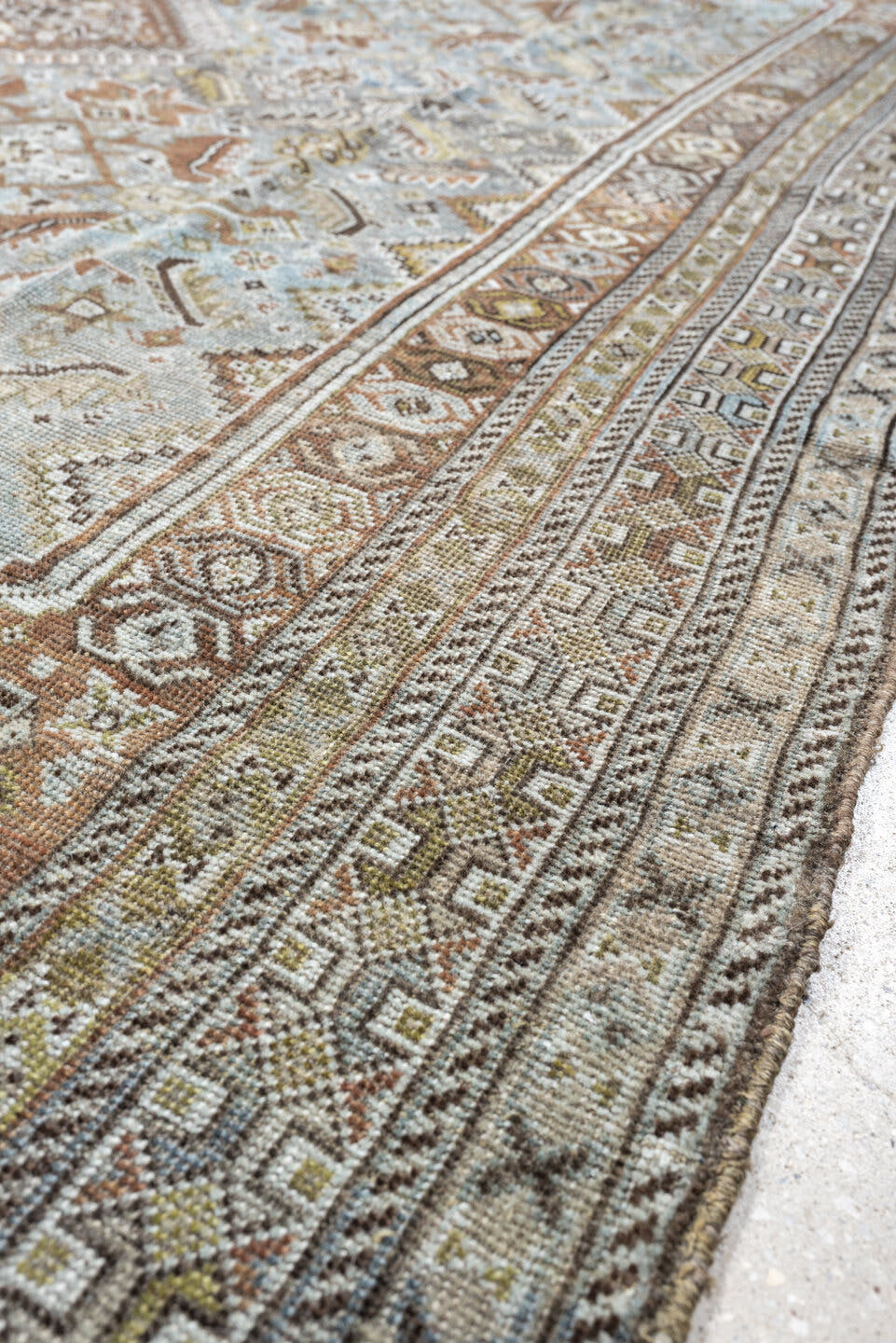 6' x 9' one-of-a-kind handmade antique Shiraz rug. Color palette: light blue, ivory, taupe, rust, brown, gold, camel