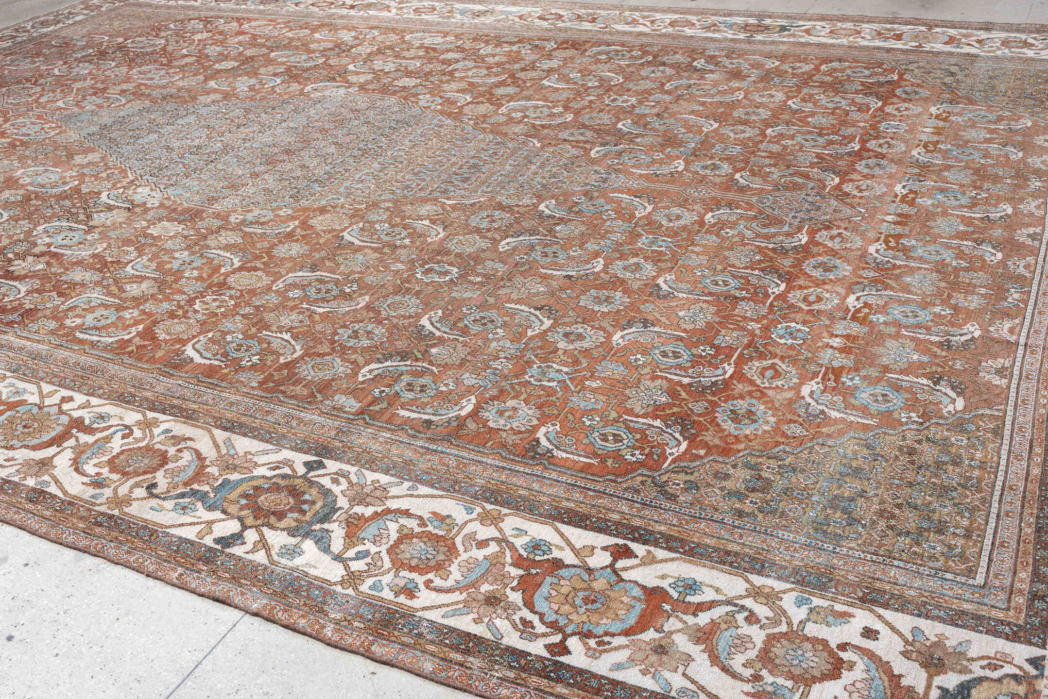 13' x 19' one-of-a-kind handmade antique Bibikabad oversize rug. Color palette: terra cotta, ivory, pale blue, taupe, camel