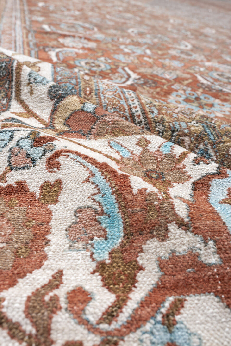 13' x 19' one-of-a-kind handmade antique Bibikabad oversize rug. Color palette: terra cotta, ivory, pale blue, taupe, camel