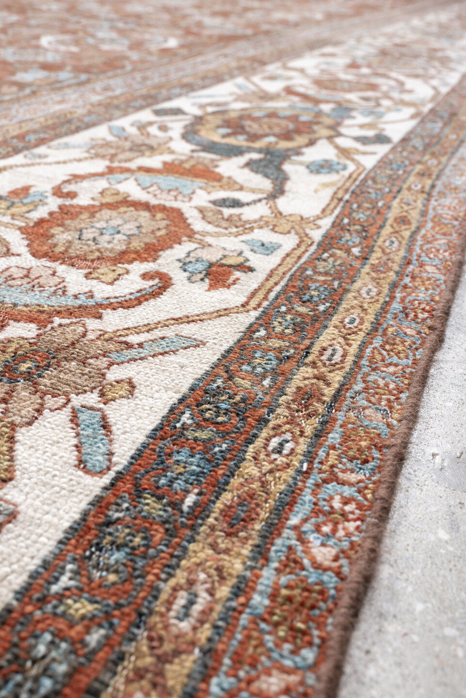 13' x 19' one-of-a-kind handmade antique Bibikabad oversize rug. Color palette: terra cotta, ivory, pale blue, taupe, camel