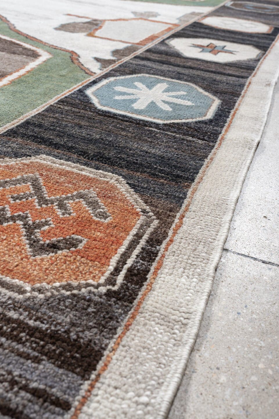 9' x 13' one-of-a-kind handmade vintage Kars large size rug. Color palette: ivory, charcoal, sage, slate, terra cotta