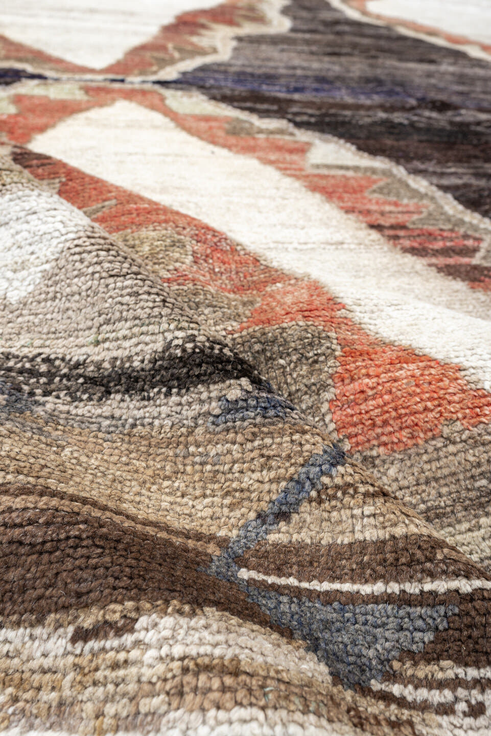 8' x 9' one-of-a-kind handmade antique Kars rug. Color palette: brown, ivory, taupe, charcoal, camel, coral, slate, cream