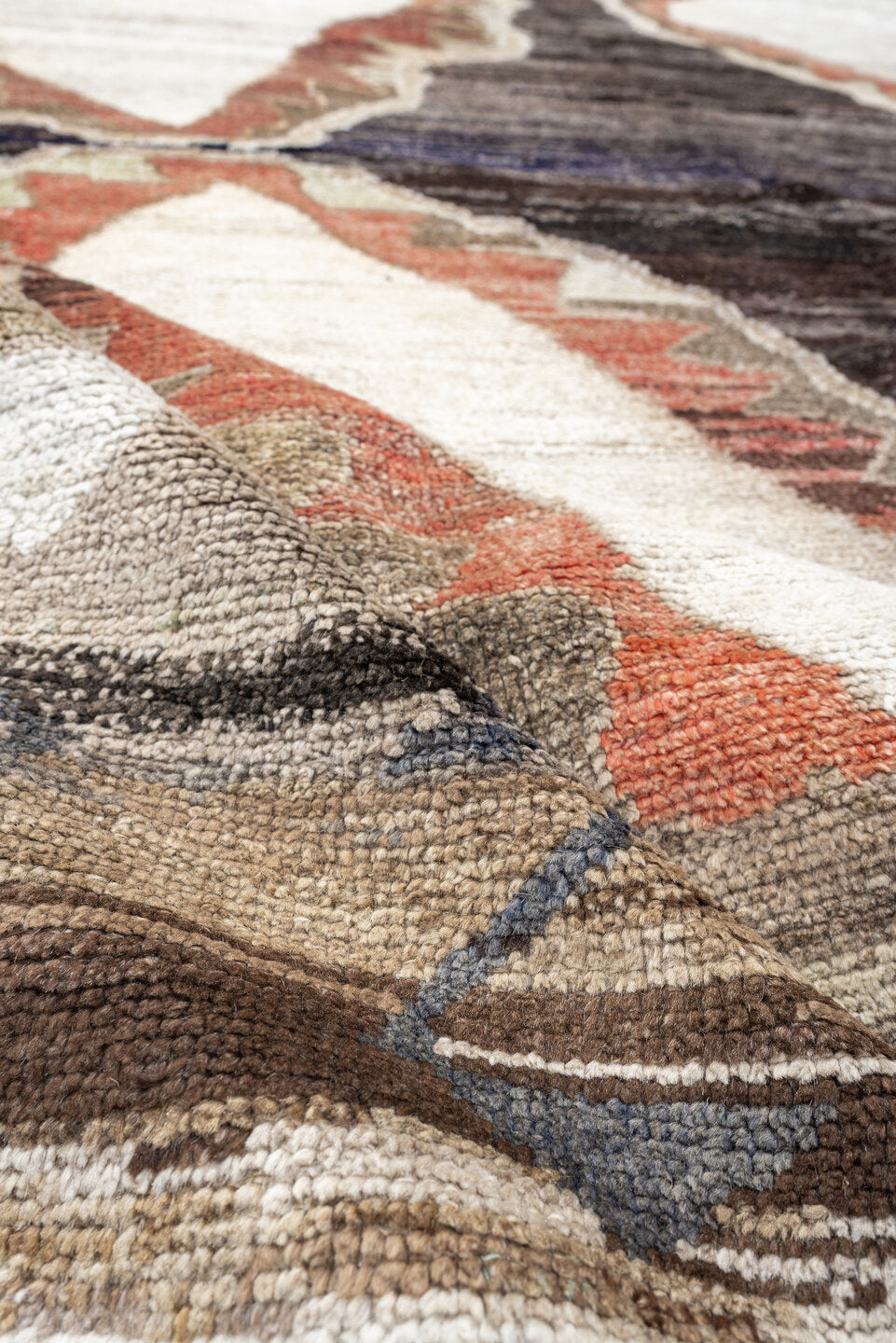 8' x 9' one-of-a-kind handmade antique Kars rug. Color palette: brown, ivory, taupe, charcoal, camel, coral, slate, cream